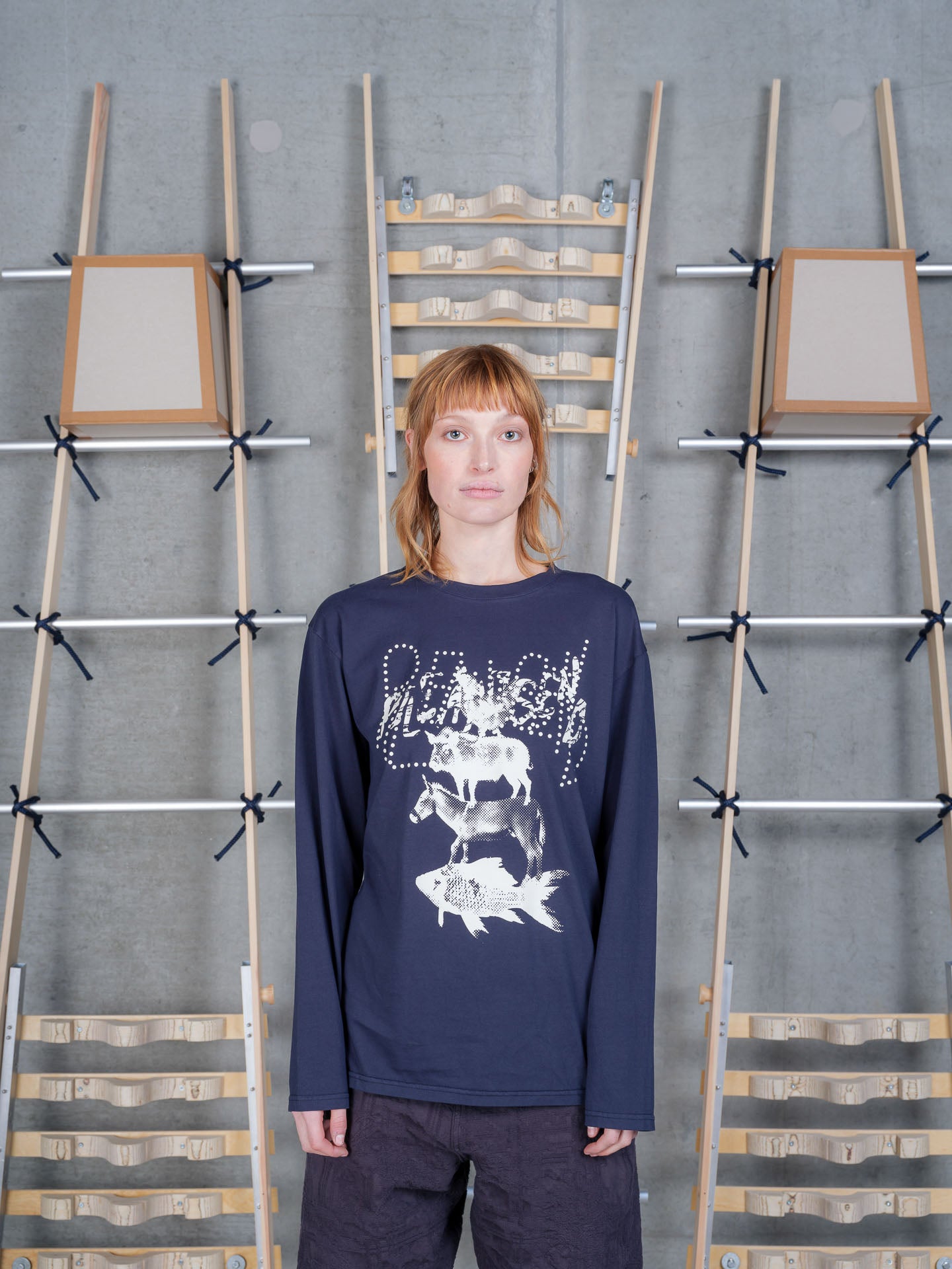Front view of a female model wearing the Henrik Vibskov Tower Swamp Blouse in Black, showcasing the oversized stacked animal graphic, crew neckline, and relaxed long-sleeve fit.