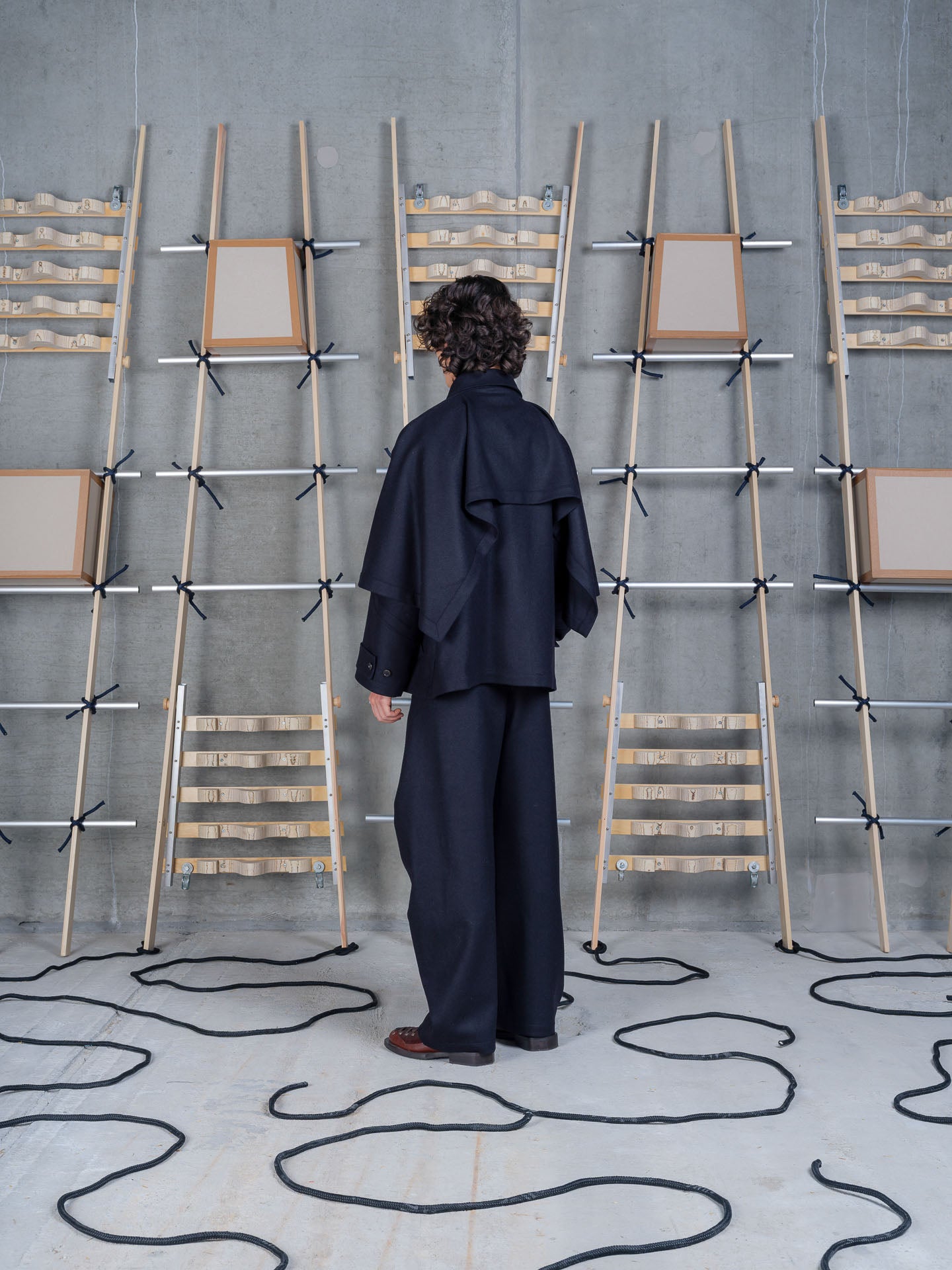Henrik Vibskov Uncut Jacket Black, model rear view, showing back construction and silhouette