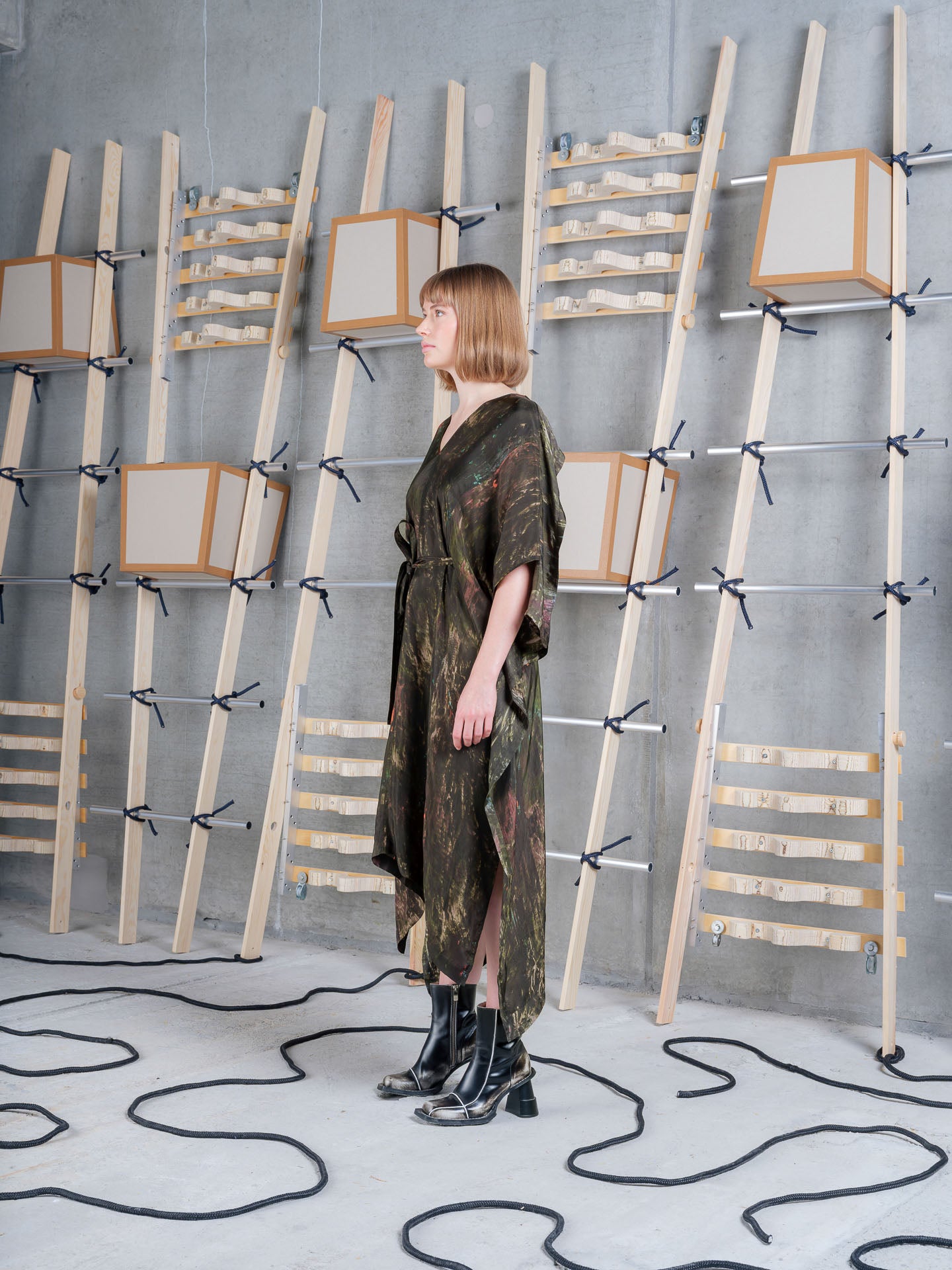 Model wearing the Henrik Vibskov Uncut Kaftan in Swamp Reflections print, side view
