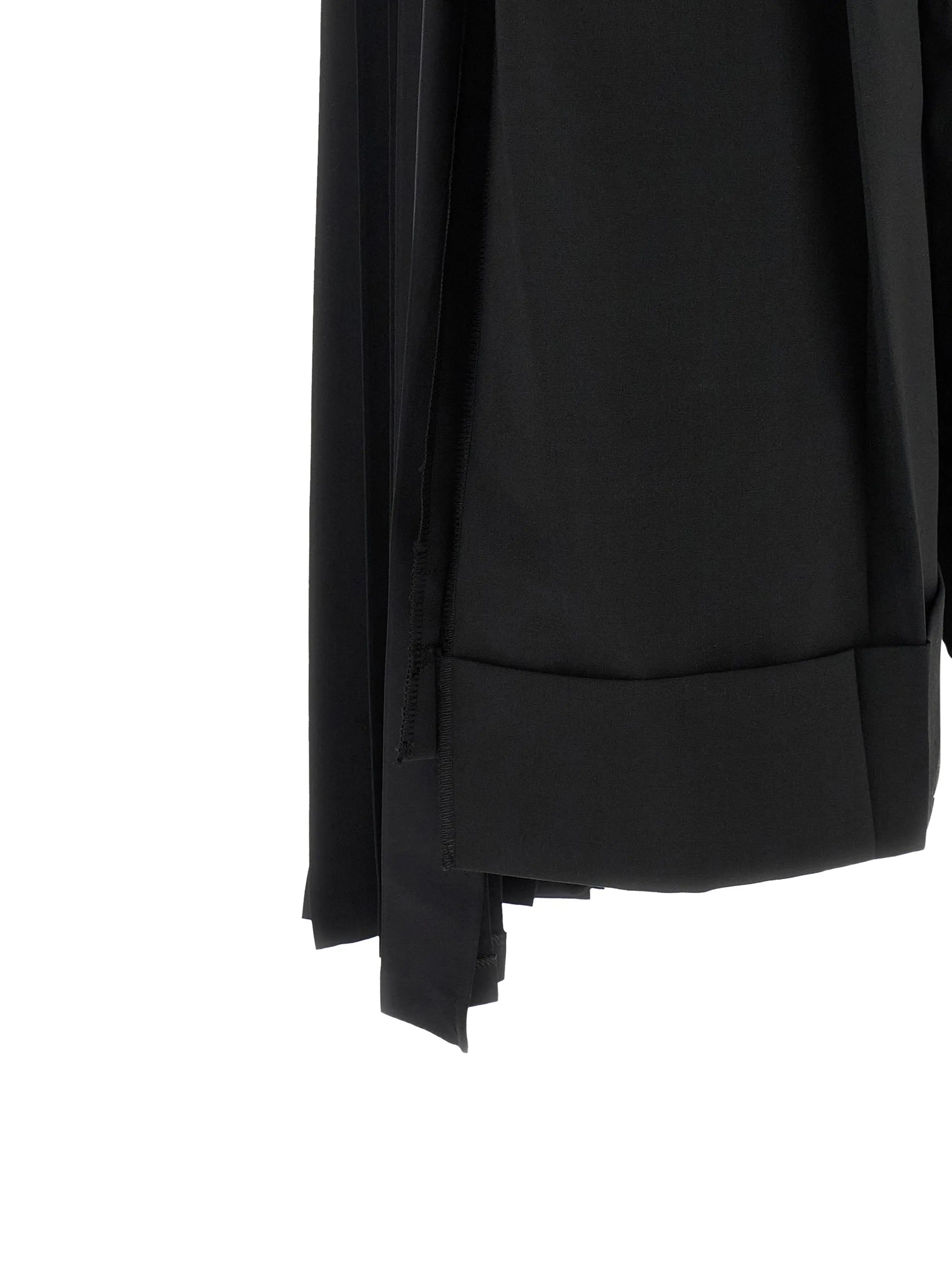Junya Watanabe Women's Layered Half-Pleated Trousers in black, close-up of turned-up cuff hem with pleated layer emerging beneath