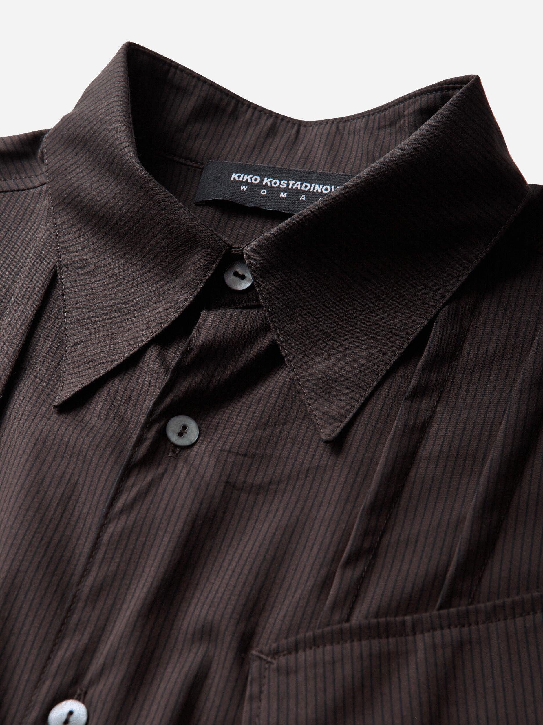 Kiko Kostadinov Woman Weka Shirt in Wood Brown Stripe, close-up of pointed collar, striped fabric and front button closure