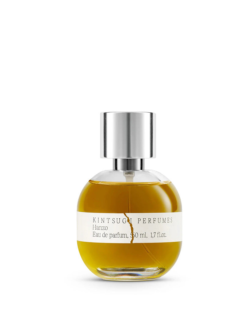 Perfume bottle with silver cap on a white background