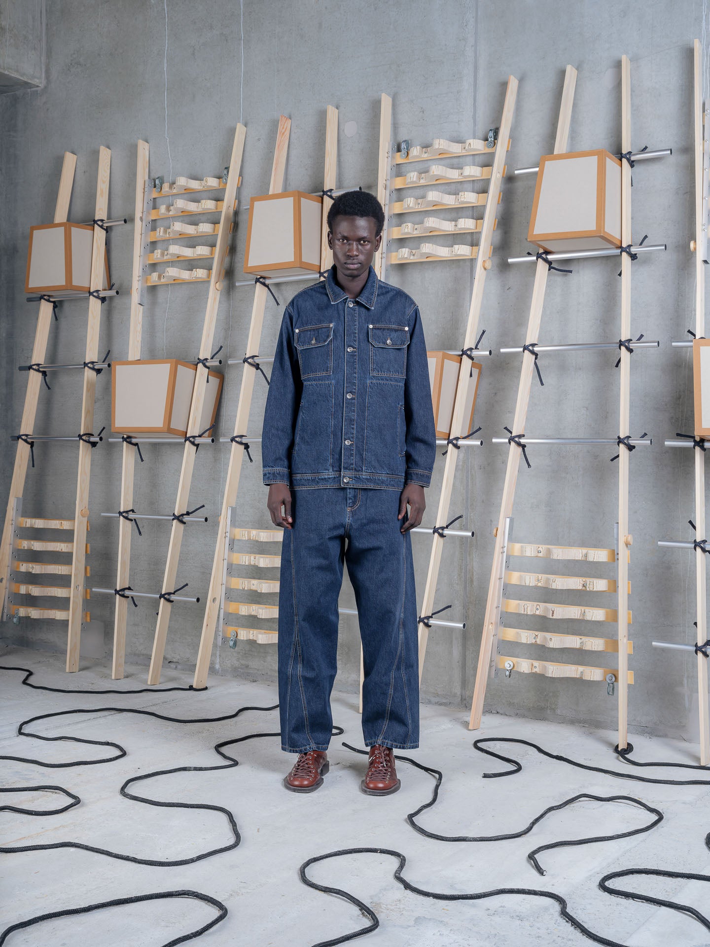 Model wearing Henrik Vibskov Mads Jacket in Rinse Denim front view
