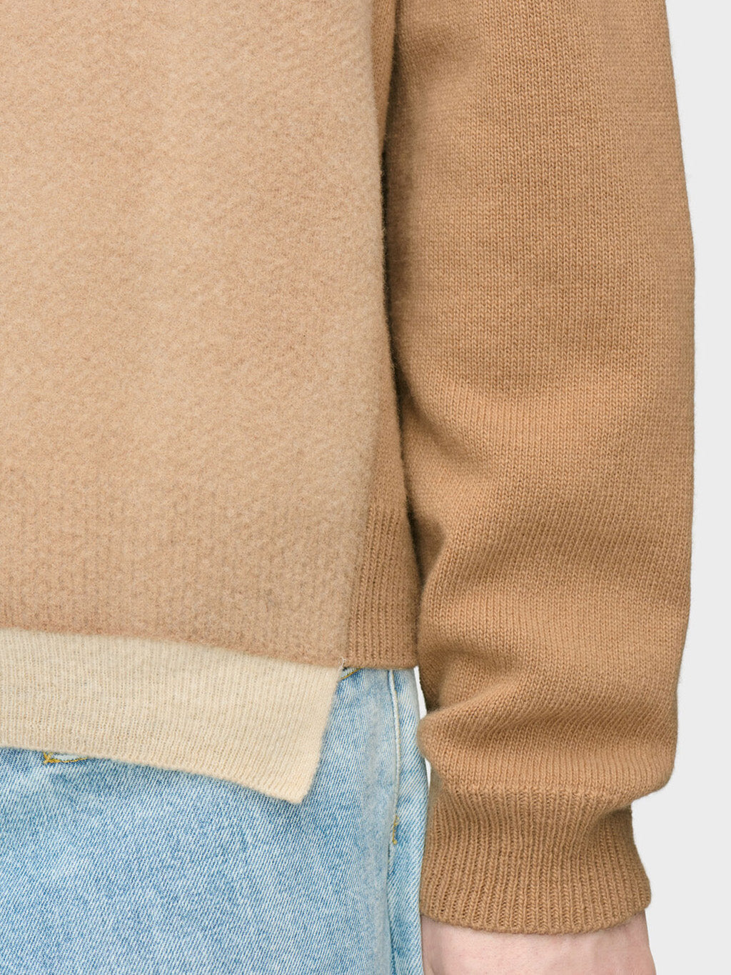 Close-up of Maison Margiela Fused Knit Wool Crewneck Sweater showing ecru contrast hem band and ribbed cuff in camel lambswool