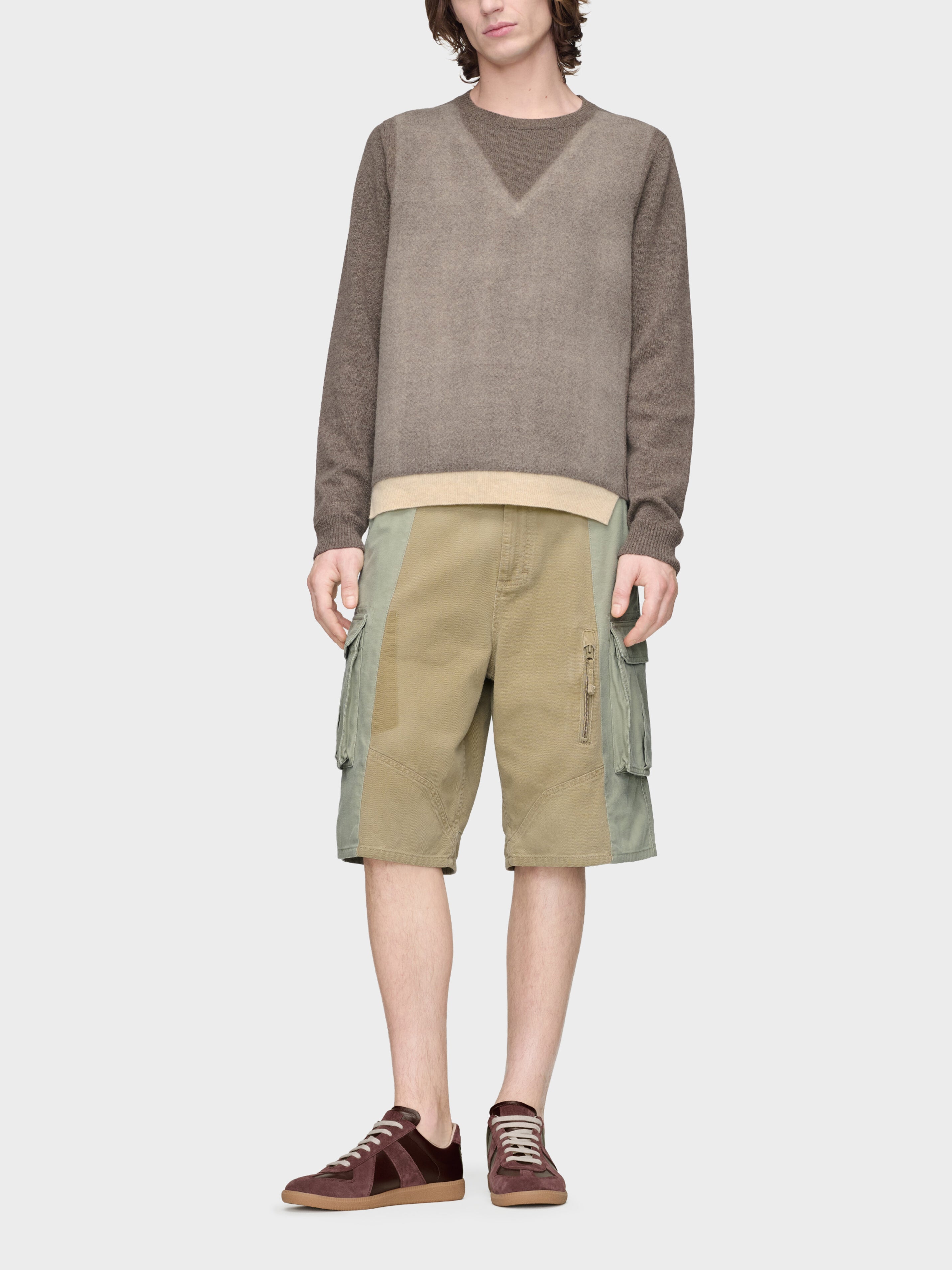 Maison Margiela Fused Knit Sweater in Mud Ecru worn on model, full-length view, contrast ecru hem detail, crew neck, relaxed lambswool silhouette