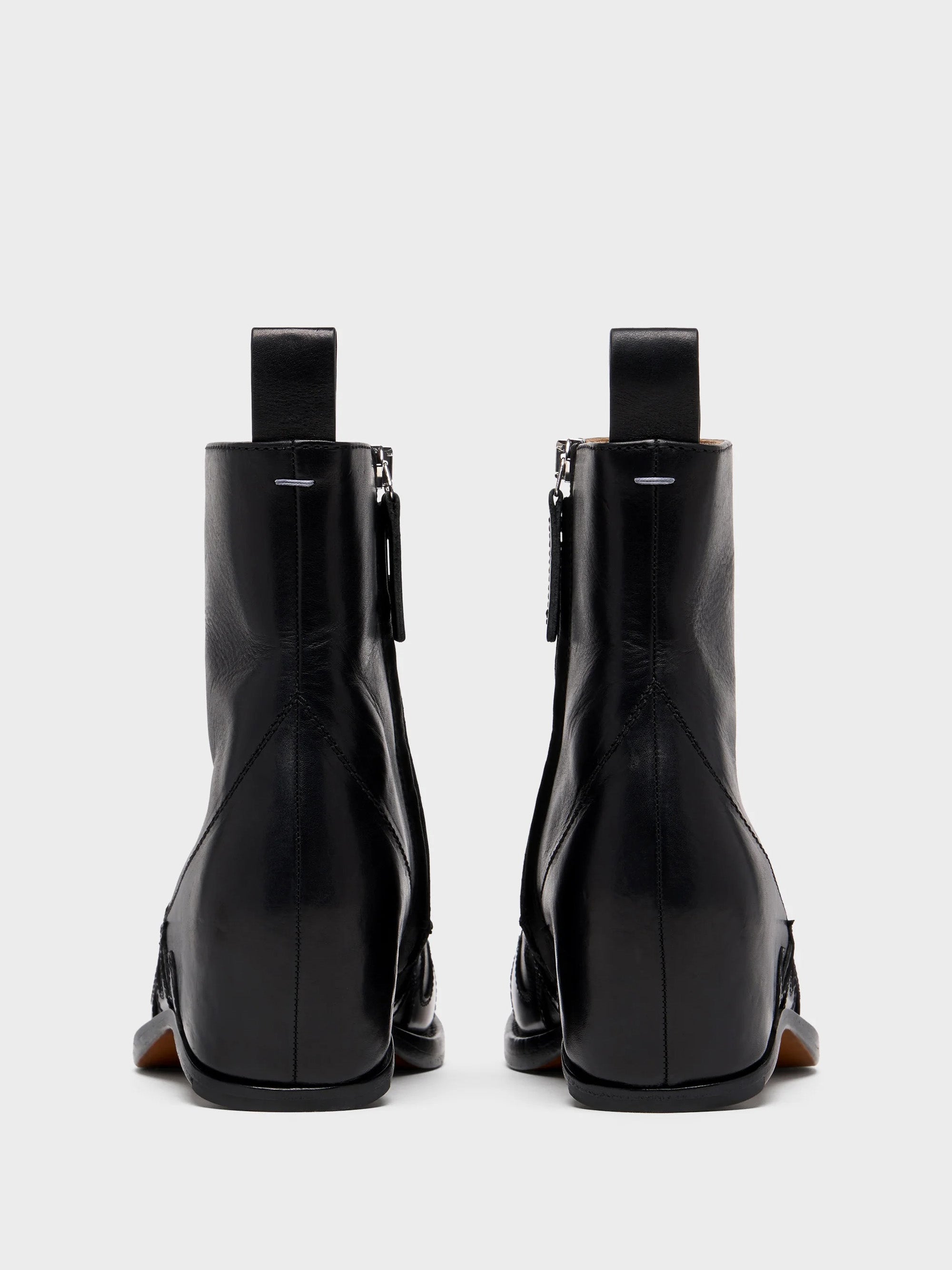 Back view of Maison Margiela Heel-Less Western Flame Boot pair showing pull tabs and signature single white stitch