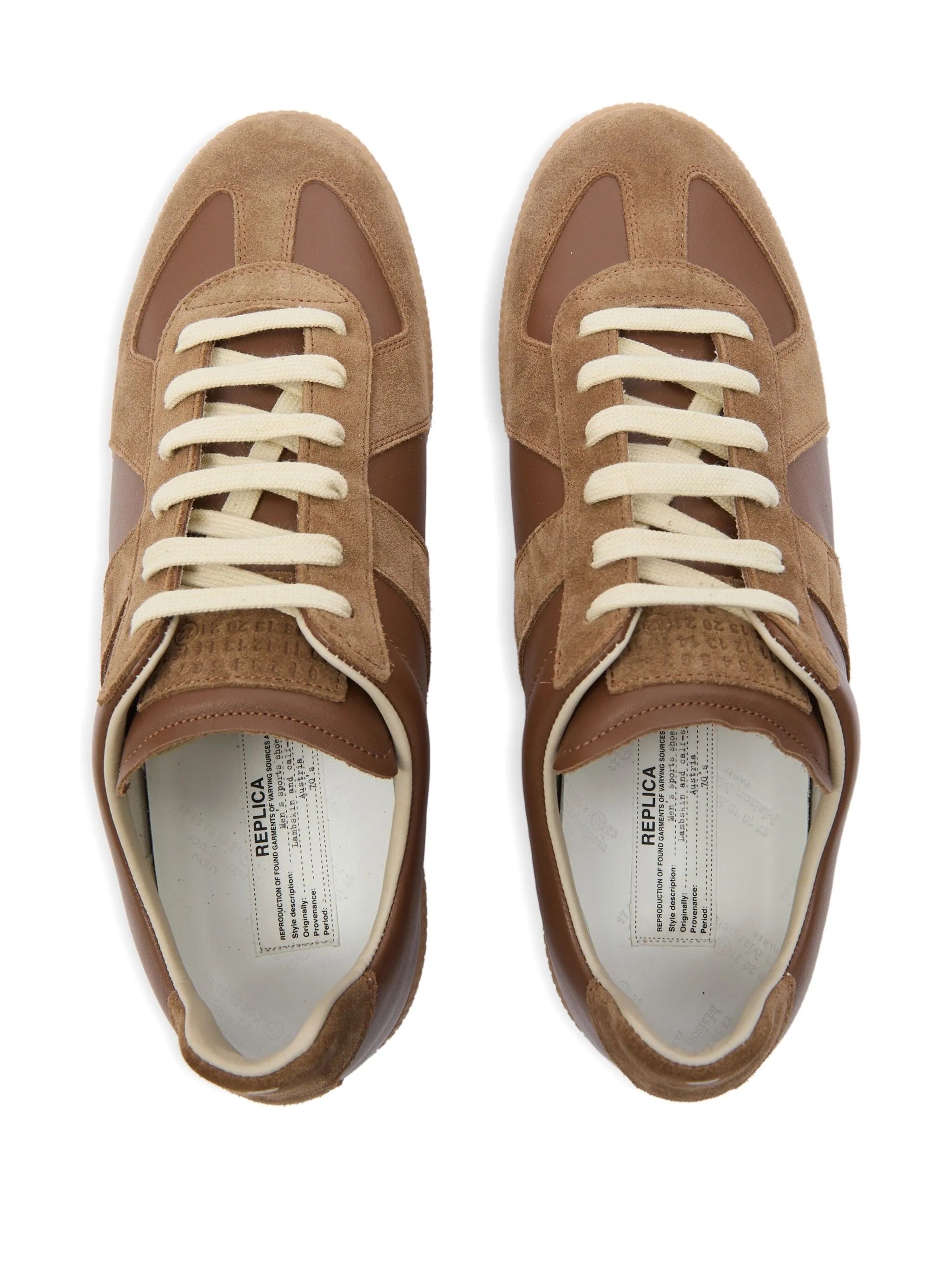 Top view of brown leather sneakers with panel design from Maison Margiela on a white background