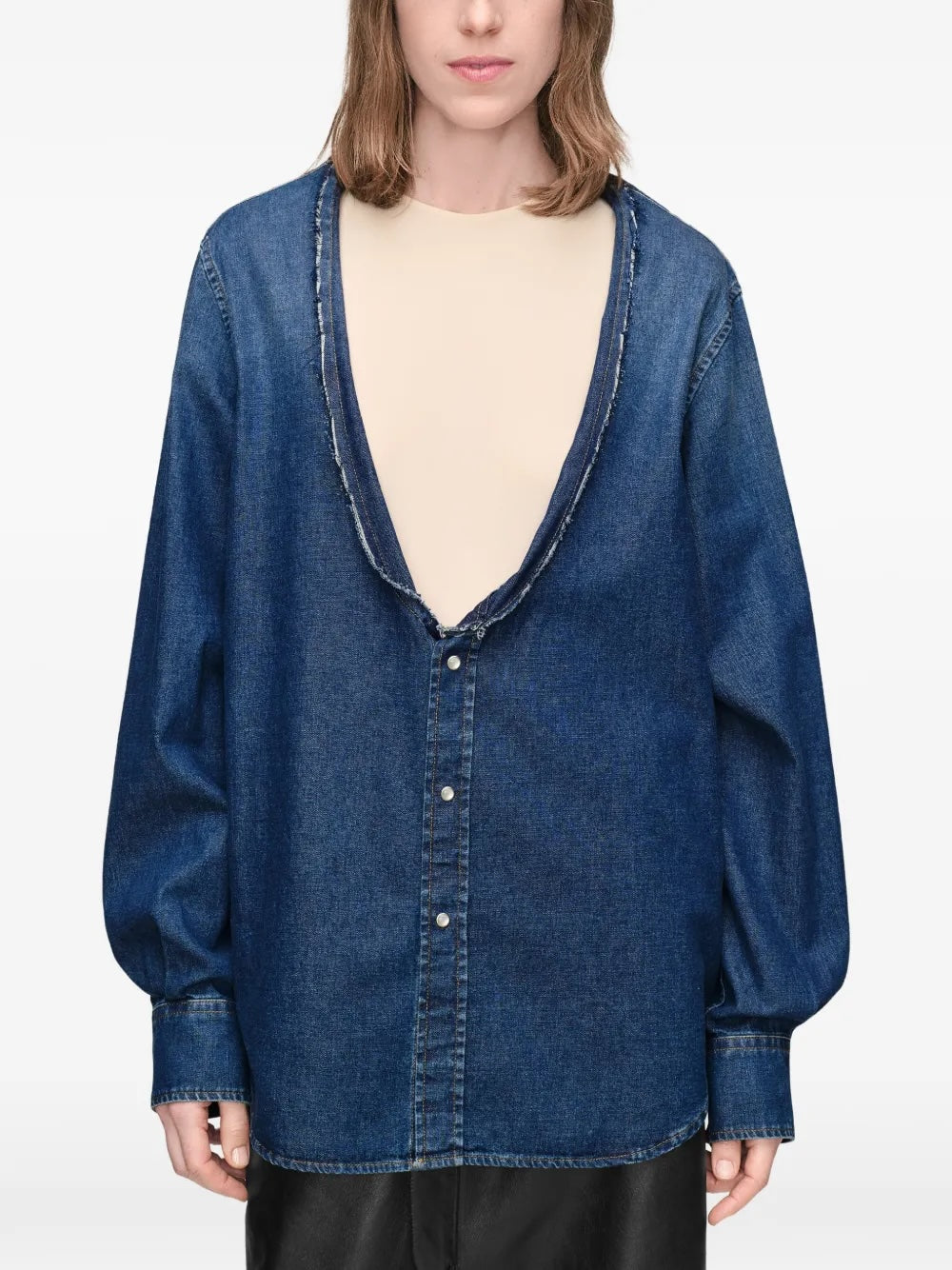 Maison Margiela V-Neck Long-Sleeved Shirt in medium blue - model front view, deep raw-edged V-neckline and oversized denim silhouette