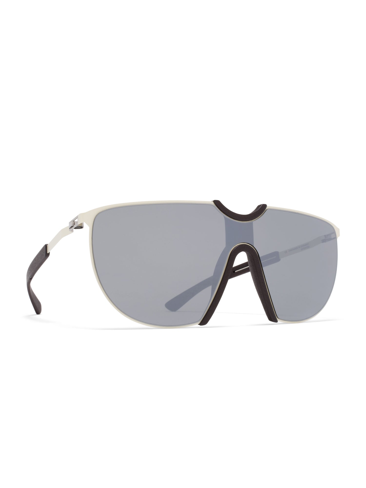 Angled view of MYKITA Aloe MH12 Sunglasses in off-white and ebony brown with silver flash tinted visor lens and slim stainless steel temples