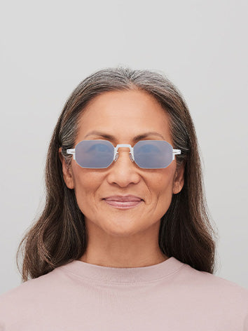 Mykita Studio 15.1 sunglasses in Frozen Silver/Shiny Silver Brown - worn shot showing silver frame with brown flash lenses on model