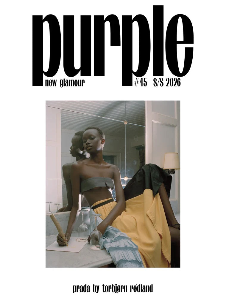 Magazine cover for 'Purple' with a model in a stylish outfit, featuring the text 'Prada by Torbjørn Rødland'