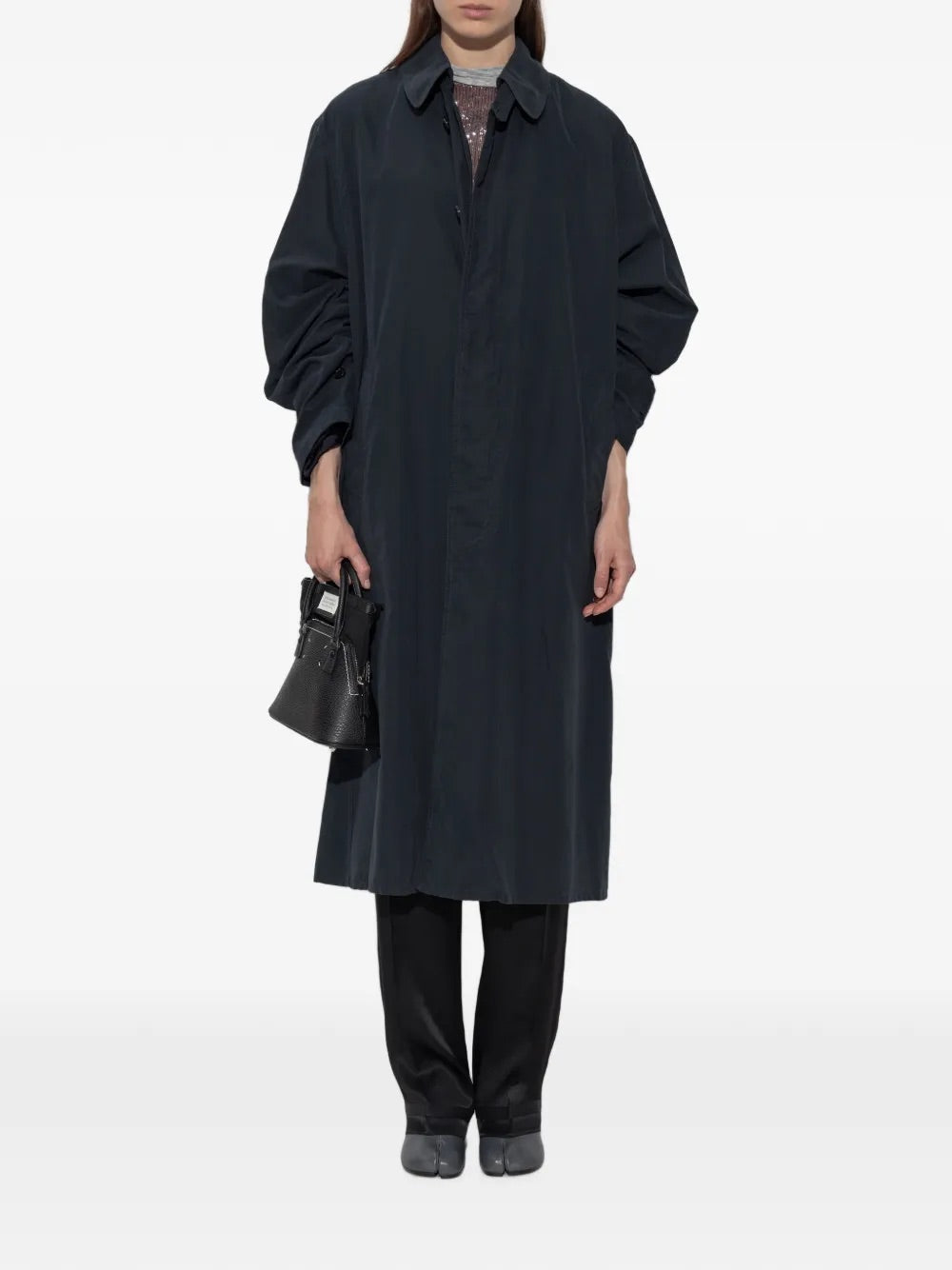 Maison Margiela Peach Trench Coat in Dark Blue styled on model
