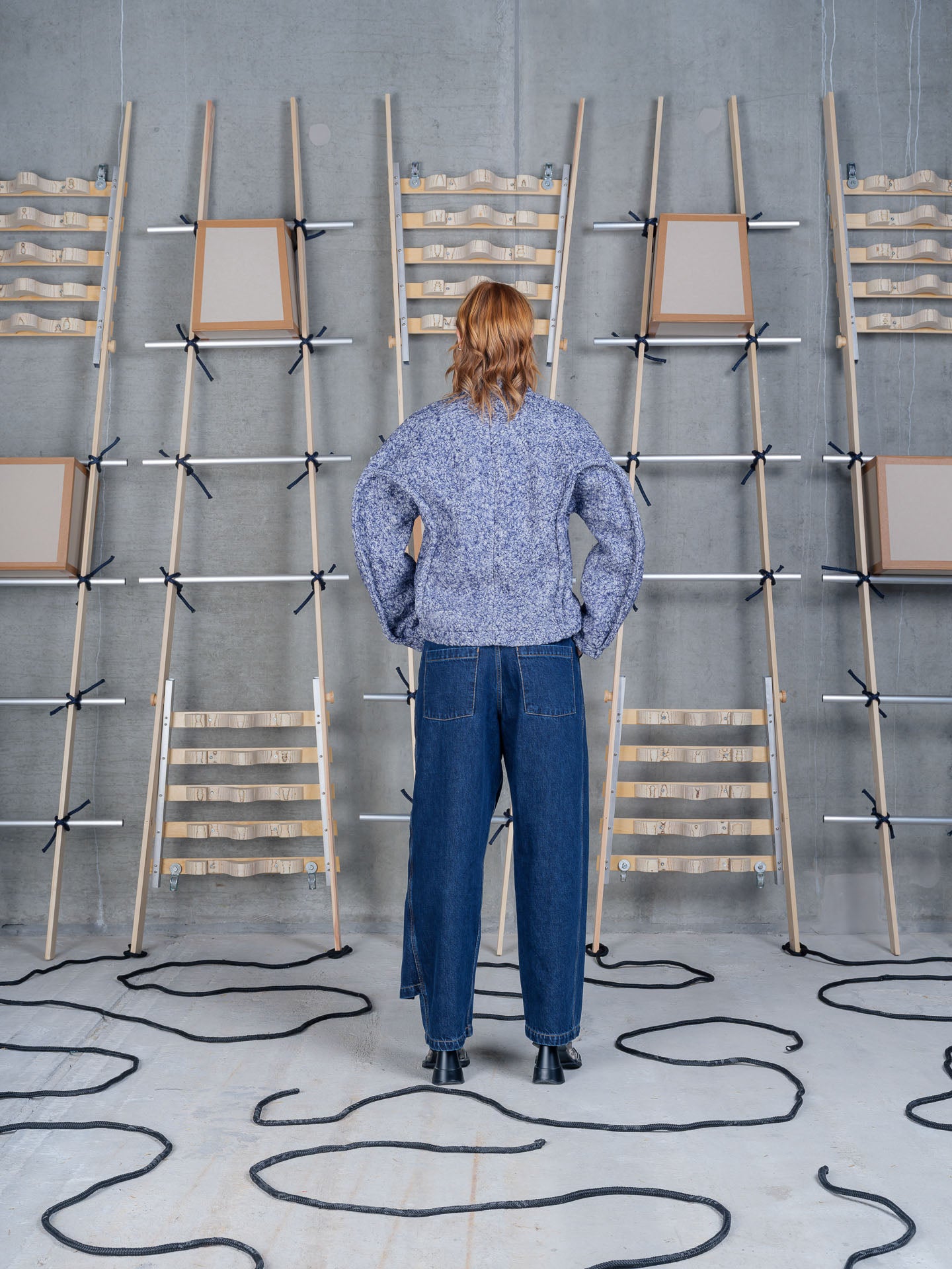 Model wearing Relaxed Dartbi Jacket in Blue Pebbles by Henrik Vibskov front view with hands in pockets