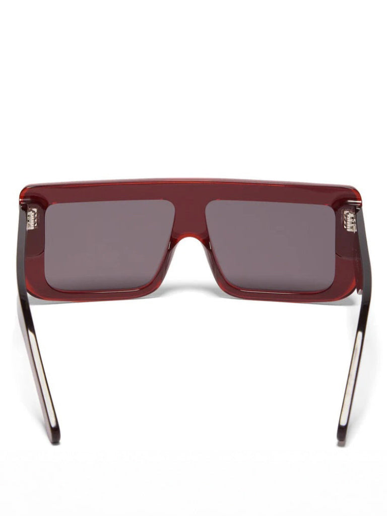Back view of Rick Owens Documenta Sunglasses in Blood Temple/Black Lens showing wide temples, black lens and silver rivet detailing