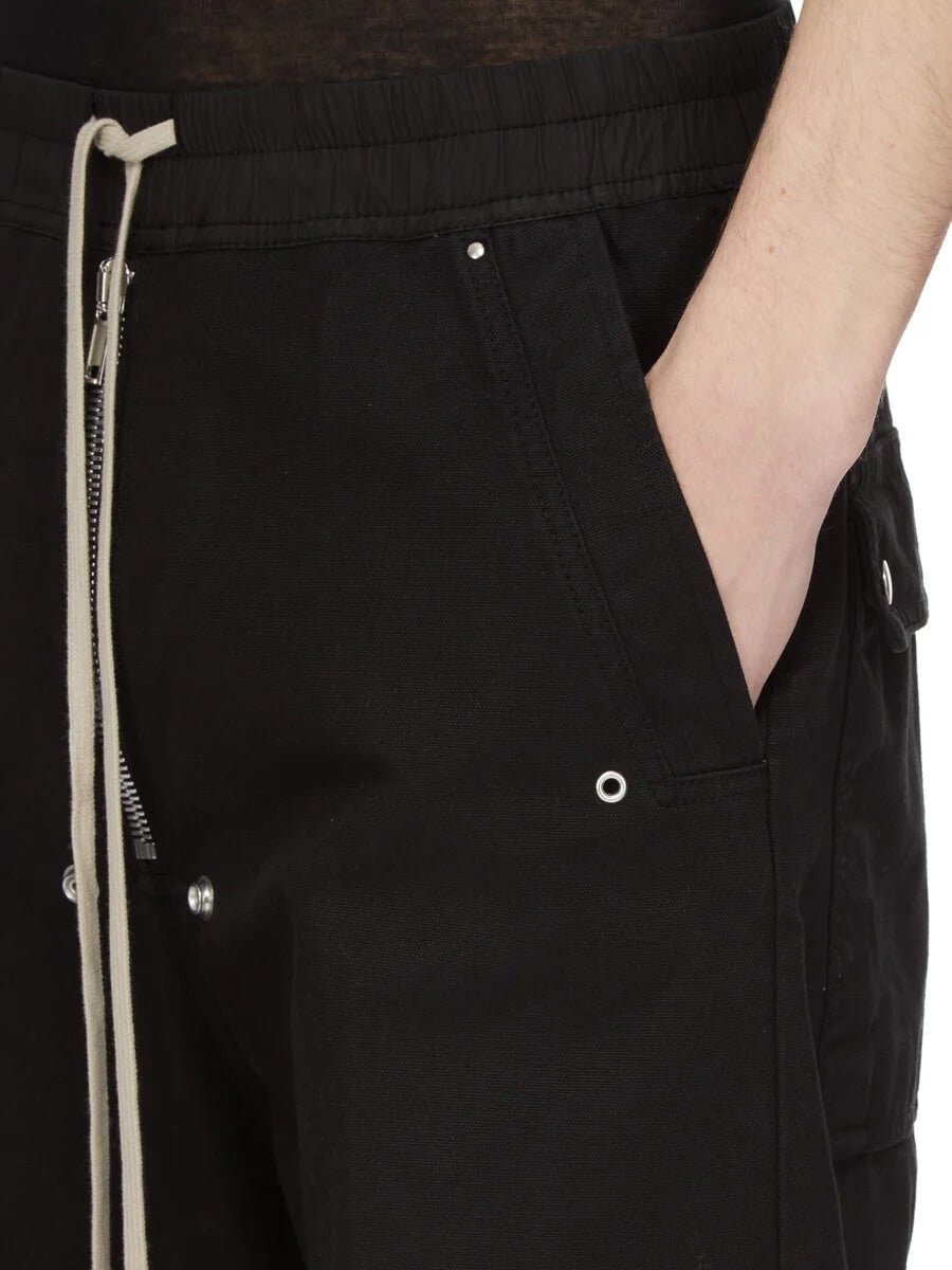 Detail view of Rick Owens DRKSHDW Geth Belas in black showing the side pocket with eyelet and rivet detailing.