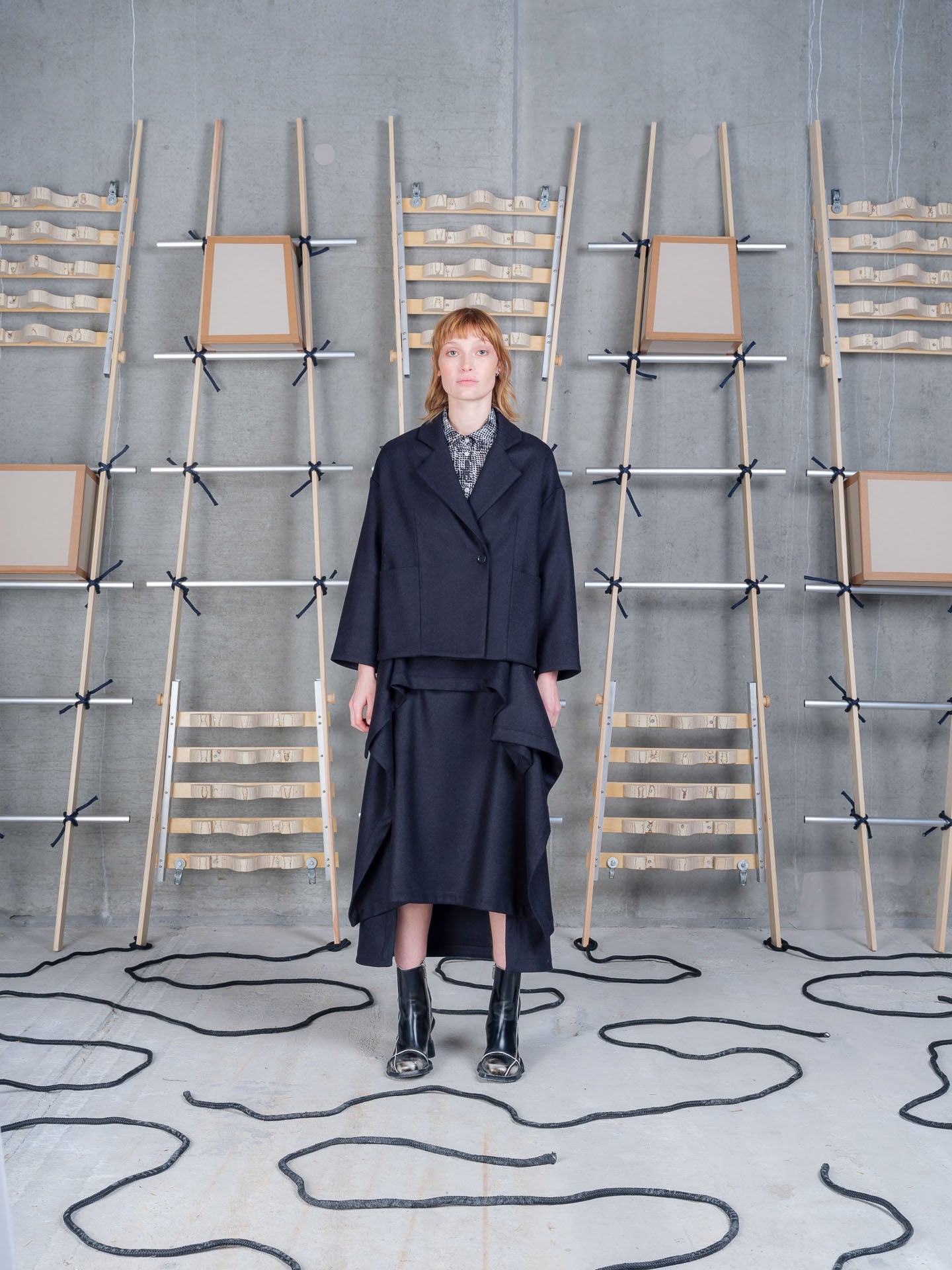 Model wearing Henrik Vibskov Shady Suit Jacket in Black front view
