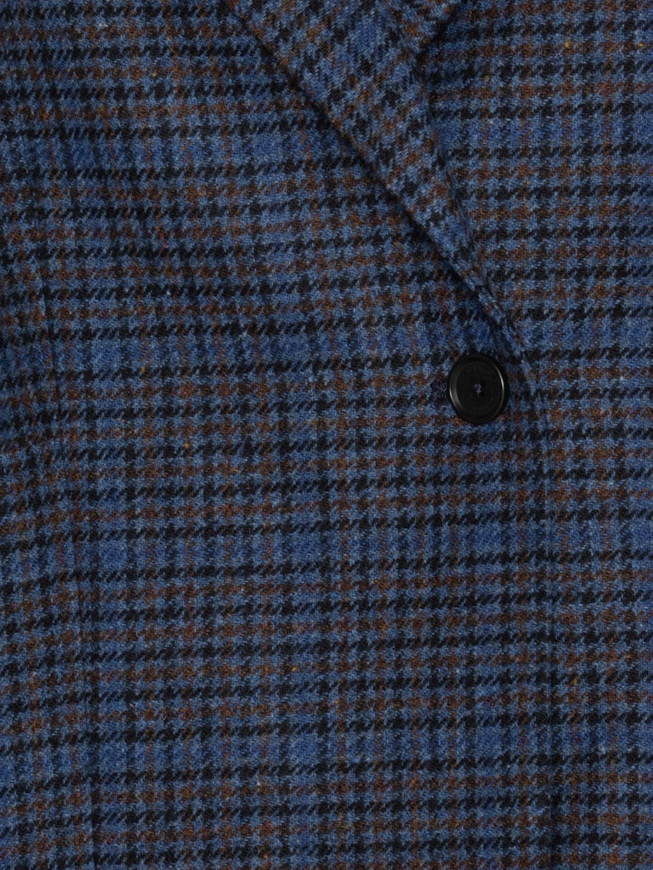 Close-up of Henrik Vibskov Shady Suit Jacket in Blue Wool Checks highlighting the blue check pattern and merino wool texture.