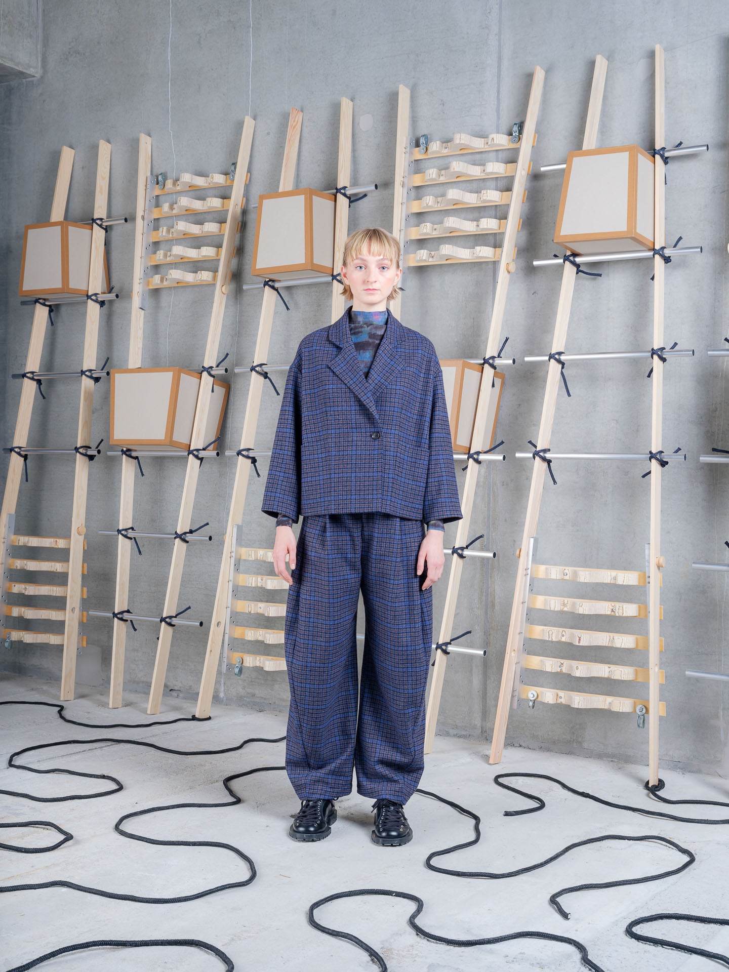 Henrik Vibskov Shady Suit Jacket in Blue Wool Checks styled with matching trousers, front view.