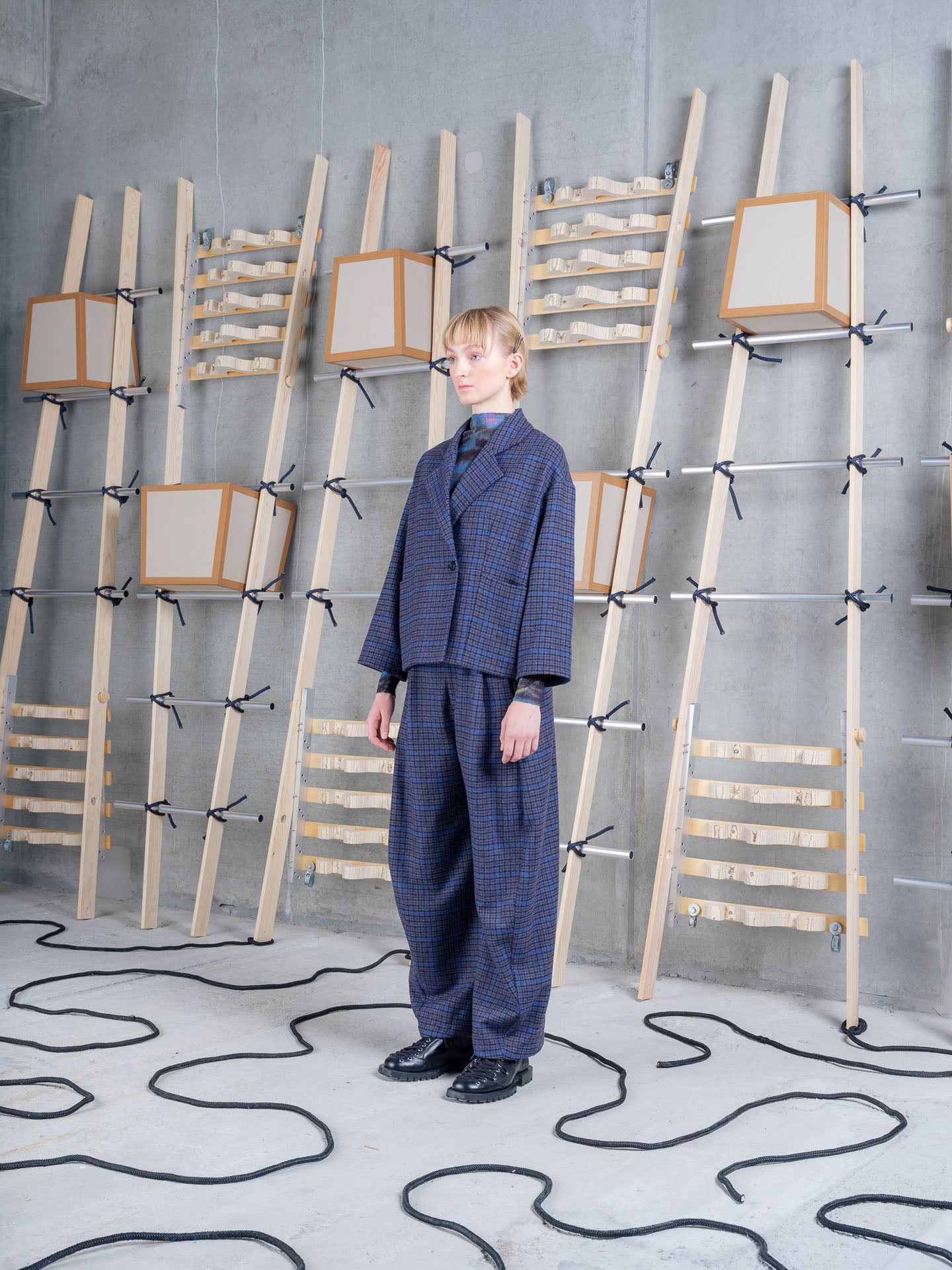 Three-quarter view of Henrik Vibskov Shady Suit Jacket in Blue Wool Checks worn as part of the full suit.