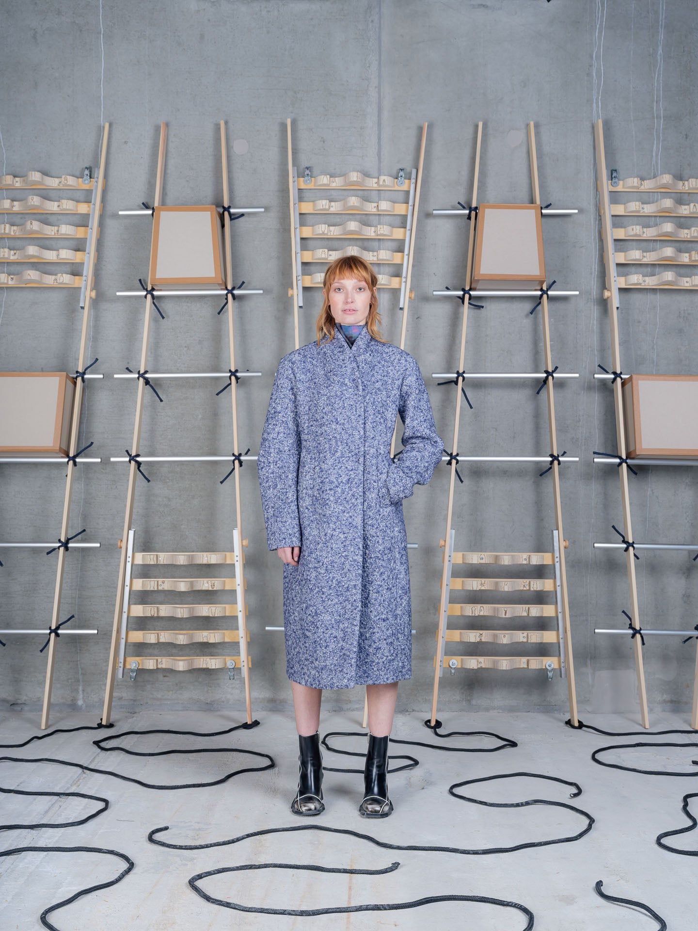 Model wearing Henrik Vibskov Shell Coat in Blue Pebbles front view
