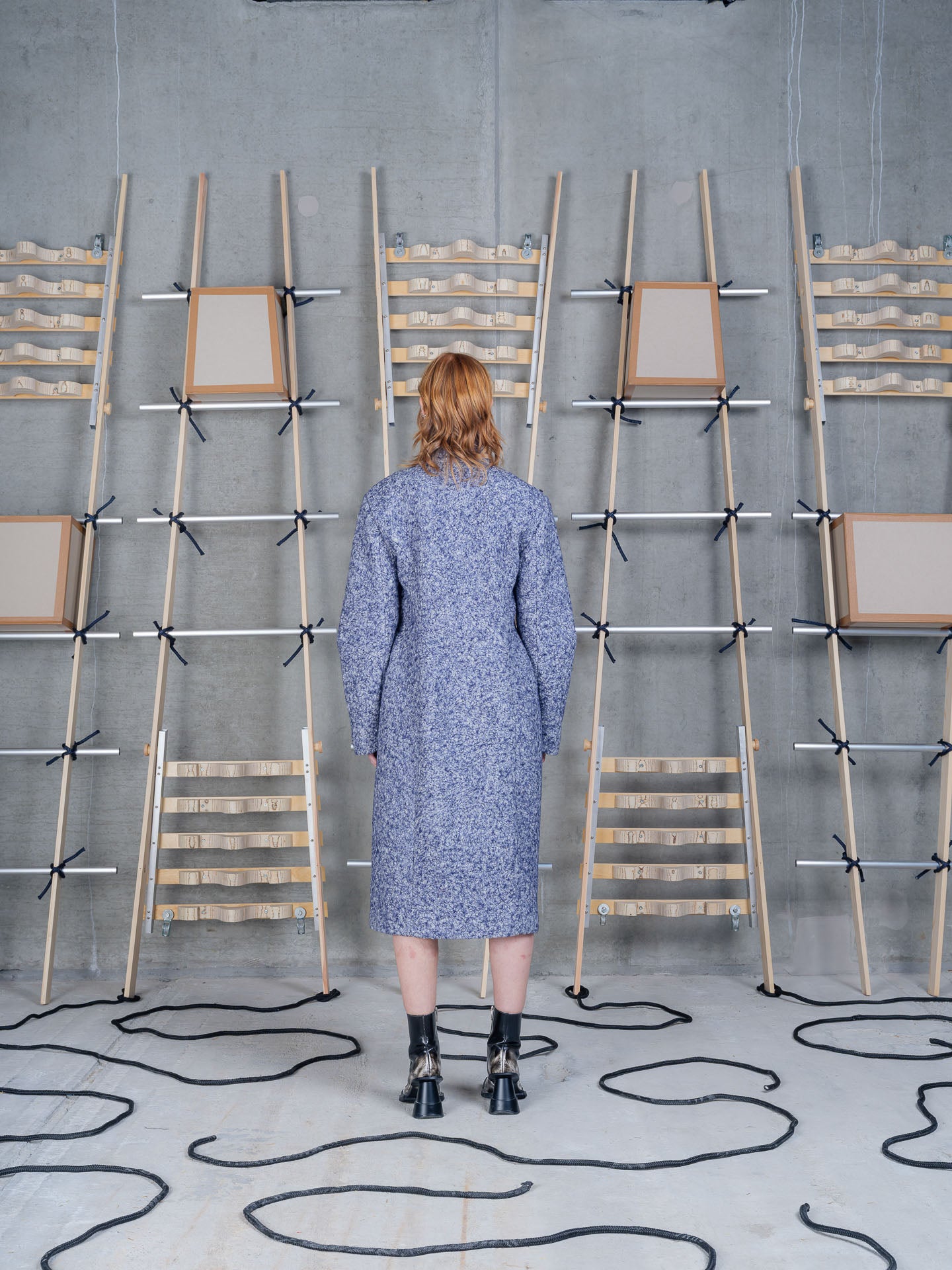 Model wearing Henrik Vibskov Shell Coat in Blue Pebbles back view