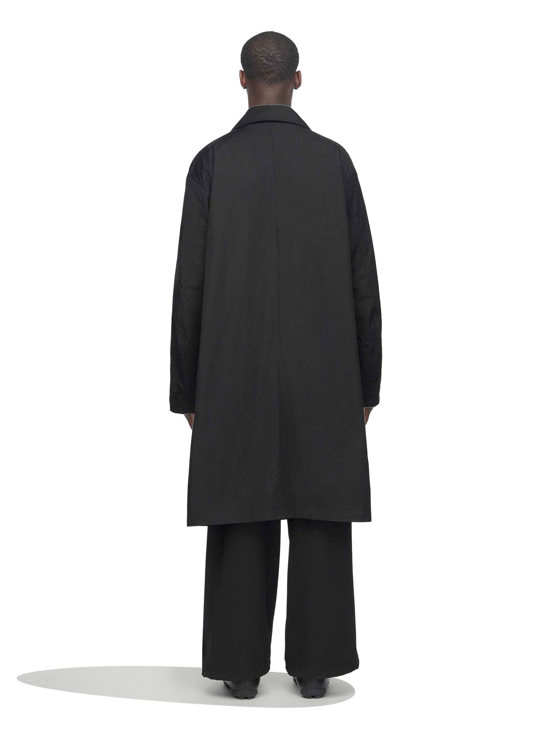 Rear view of the model wearing the Y-3 Spun Nylon Cabban Coat in Black.