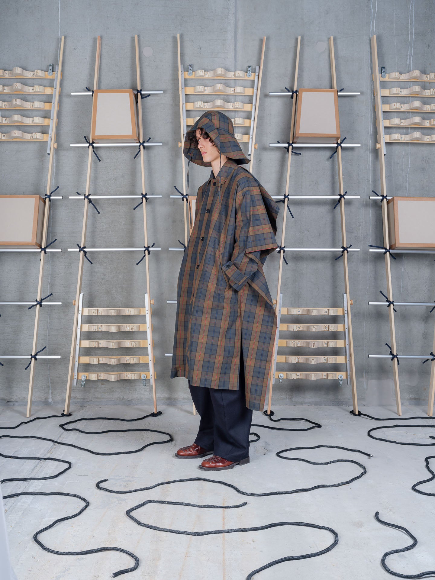 Henrik Vibskov Uncut Coat in Tartan Dry Wax worn side view
