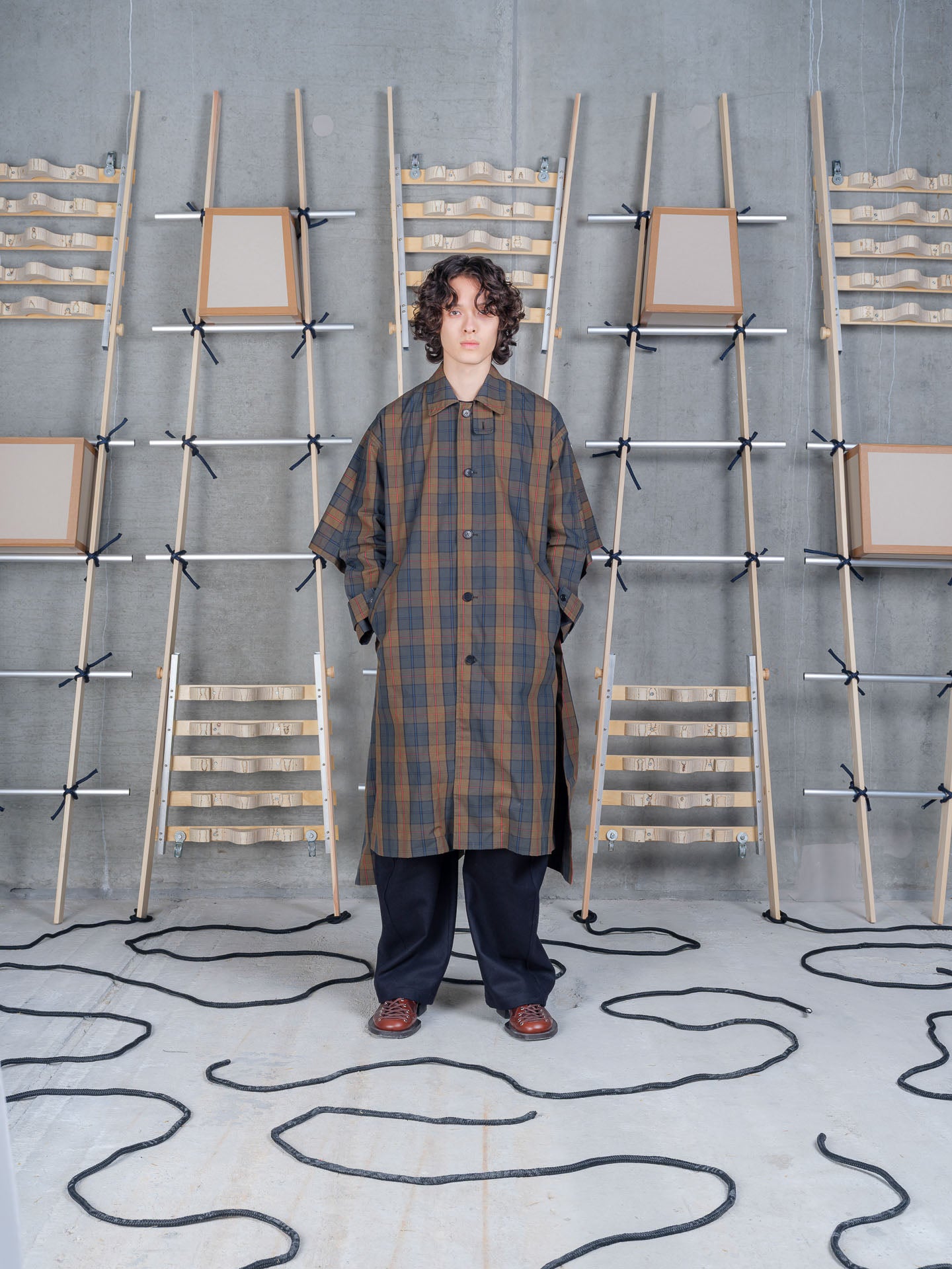 Henrik Vibskov Uncut Coat in Tartan Dry Wax worn front view portrait
