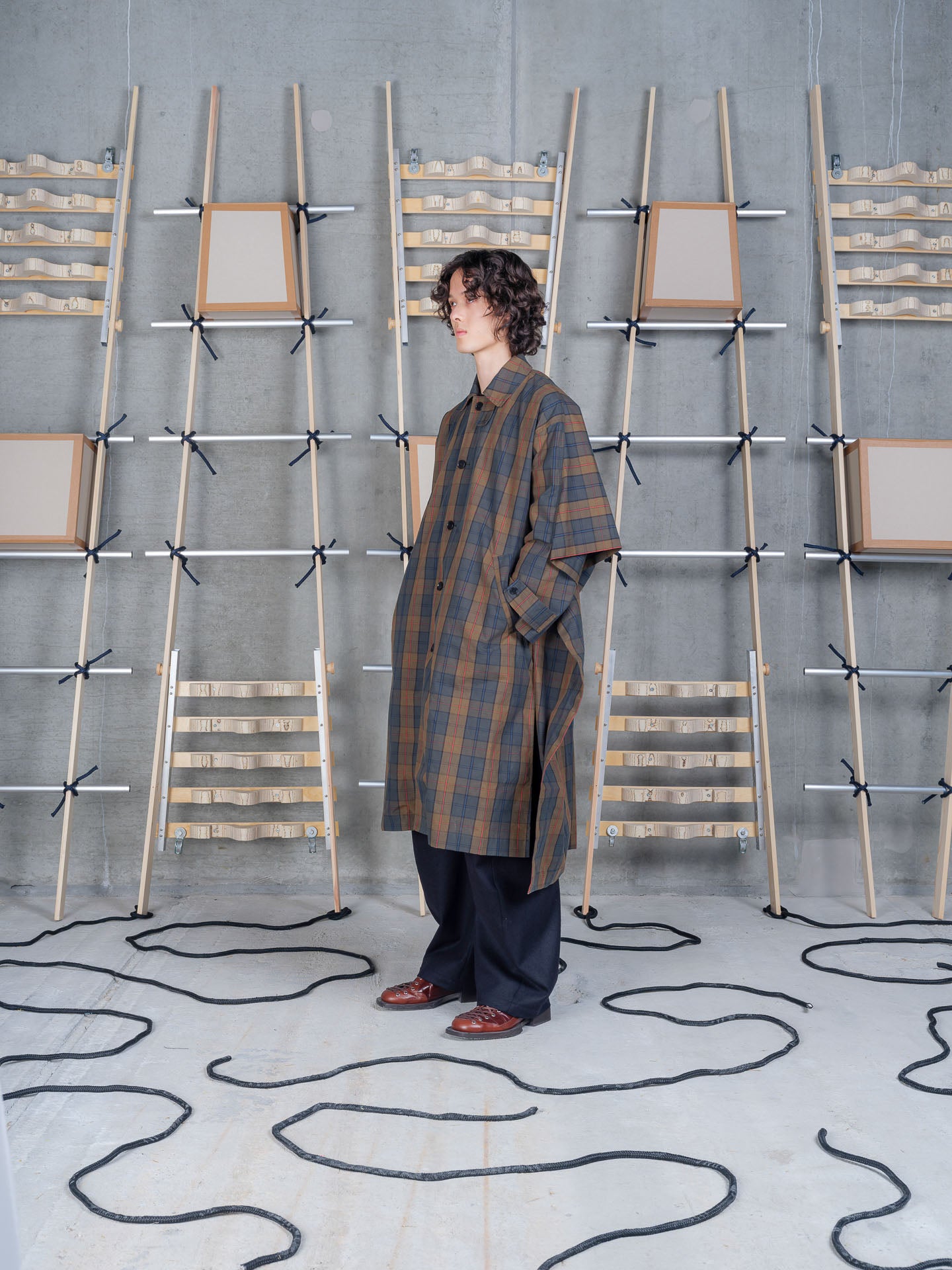 Henrik Vibskov Uncut Coat in Tartan Dry Wax worn side profile
