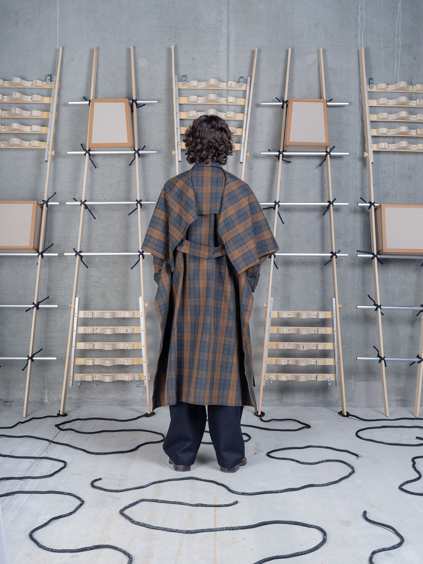 Henrik Vibskov Uncut Coat in Tartan Dry Wax worn back view
