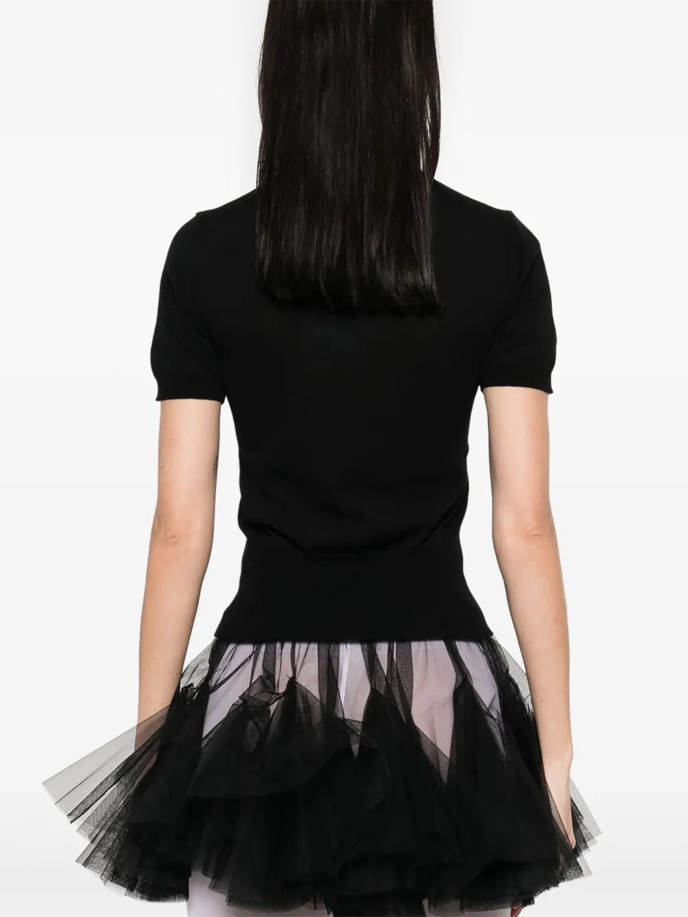 Model wearing Bea Top in Black by Vivienne Westwood, back view of slim-fit black crew neck top with short sleeves and ribbed hem, Spring/Summer 2026