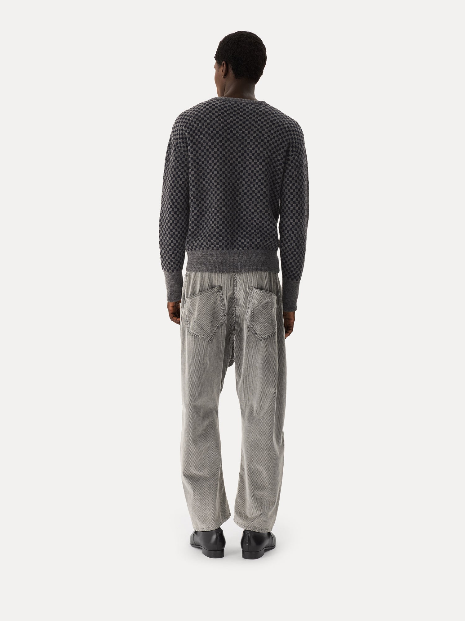 Back view of Vivienne Westwood Checkmate Jumper in grey navy checkerboard jacquard with straight hem and ribbed cuffs