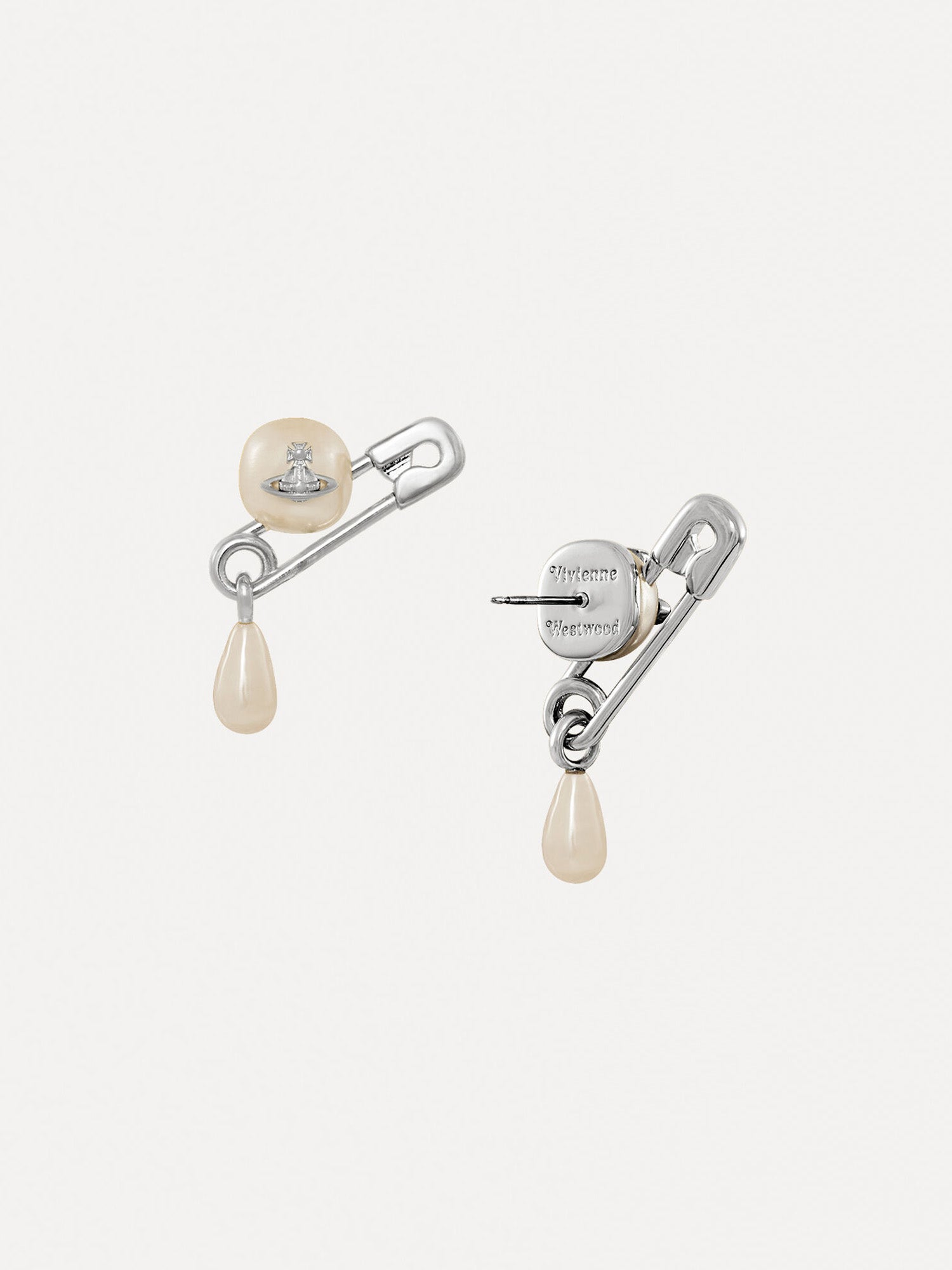 Back view of a pair of pearl earrings from Vivienne Westwood with small stud and safety pin design on a white background