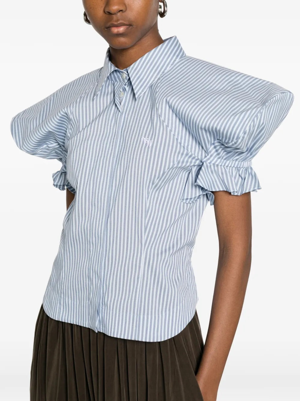 Model wearing Gexy Top in Blue/White by Vivienne Westwood, closeup of pointed collar, concealed button fastening and gathered sleeve detail on blue and white striped cotton-blend top, Spring/Summer 2026
