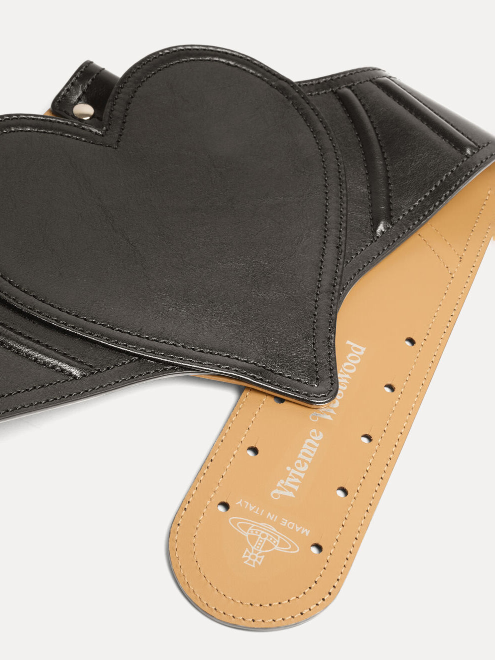 Close-up of Vivienne Westwood Heart Corset Belt in black showing curved seam detailing, tonal topstitching and multiple sizing holes