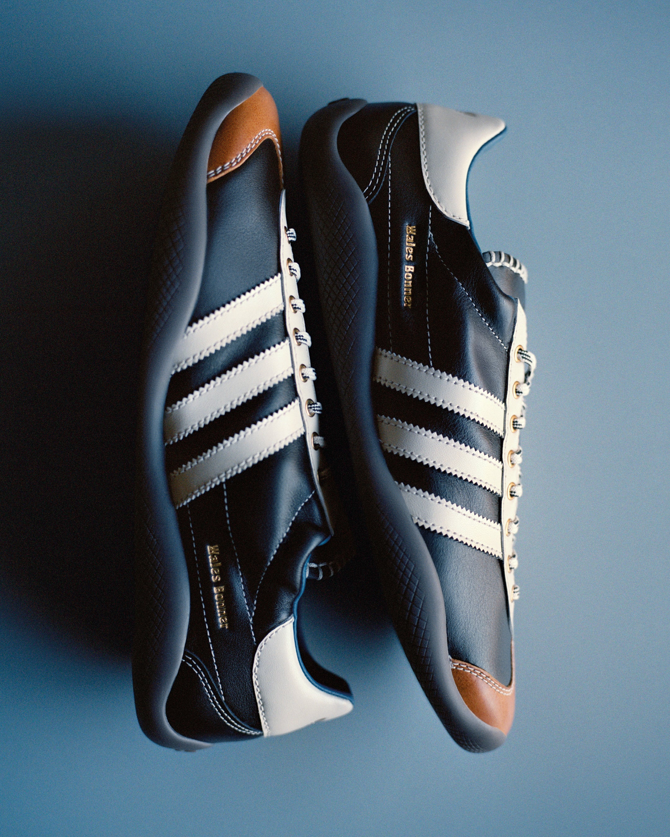 Wales Bonner x Adidas Karintha OG Sneakers in Core Black / Wonder White / Lush Blue, black leather with white three stripes and tan toe cap.
