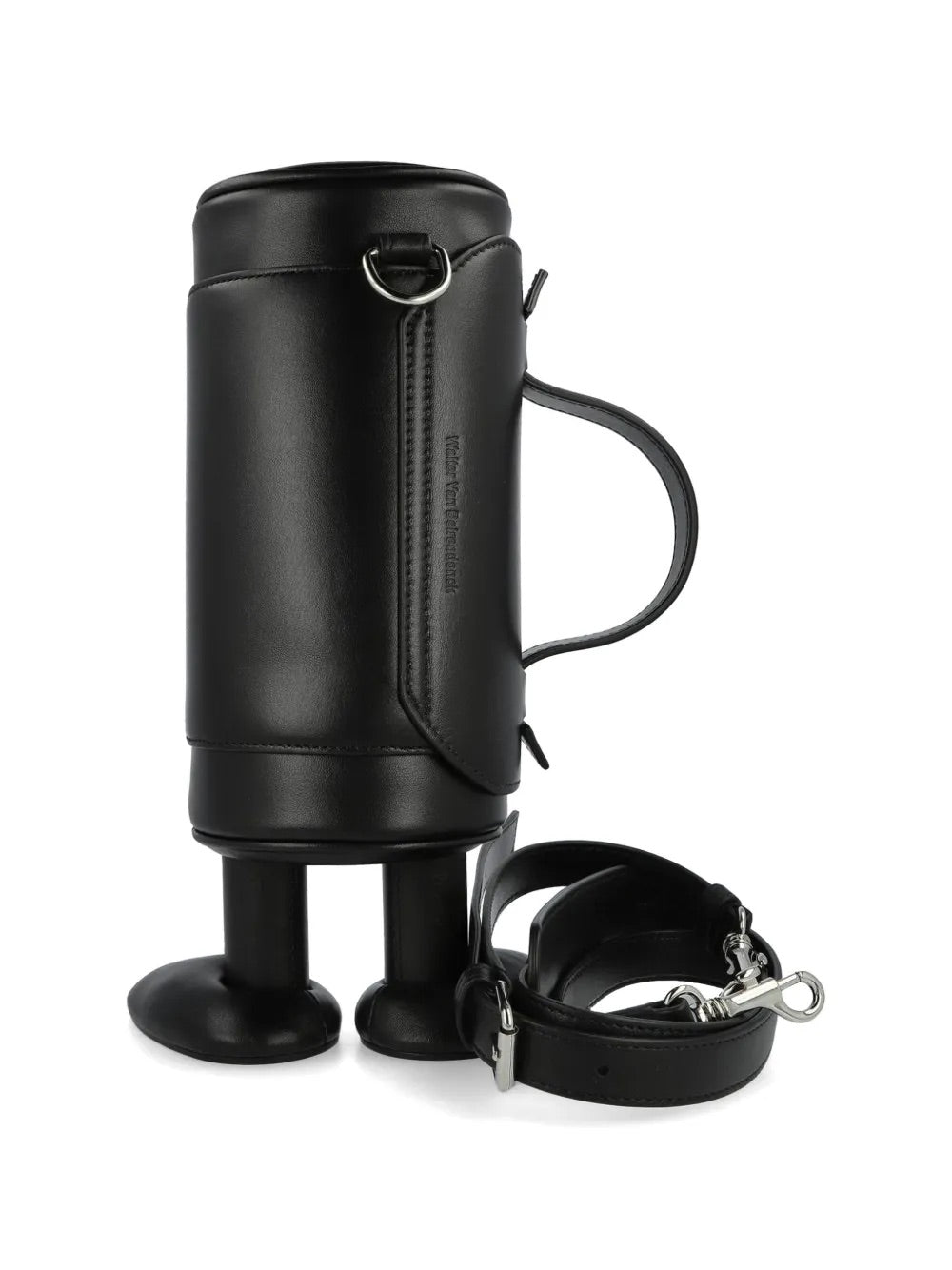 My Cilinder Friend Bag in Comb. I Black by Walter Van Beirendonck, side view of black leather cylindrical bag with sculptural footed base, detachable shoulder strap, white circle appliques and red logo charm