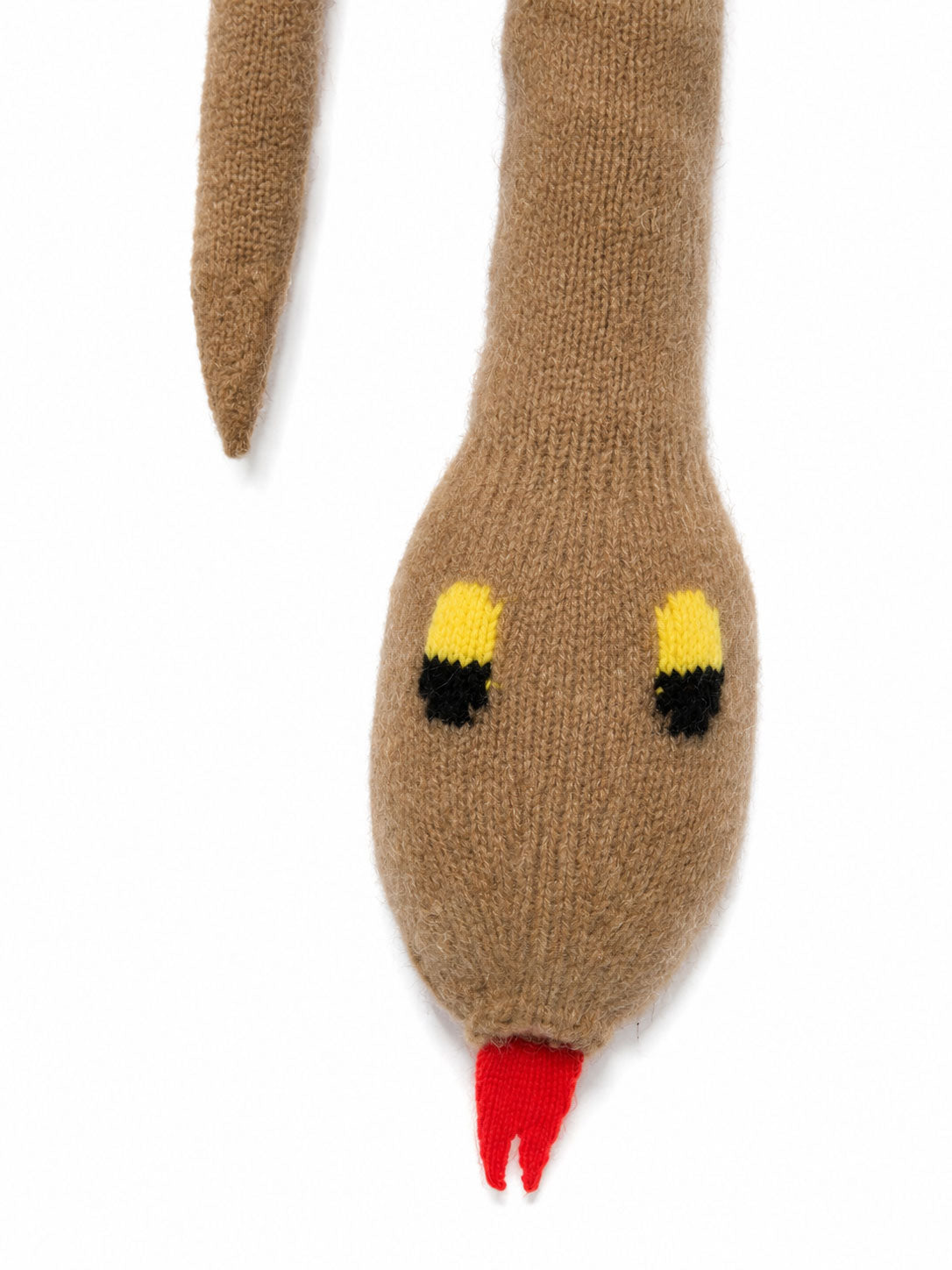 Close-up of the Walter Van Beirendonck Snake Scarf in Camel showing the textured knitted snake head, contrast eyes and tongue detail.