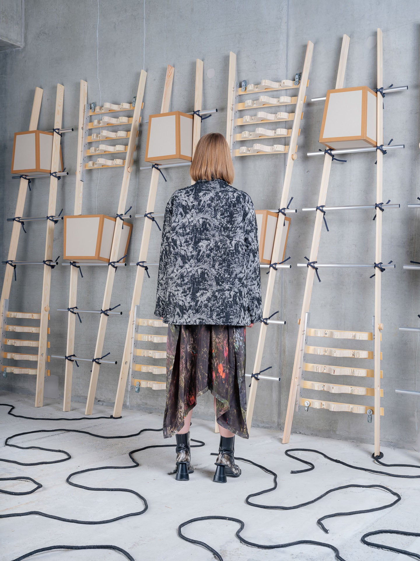 Cara wearing Henrik Vibskov Wheel Jacket in Black 3D White, back view.