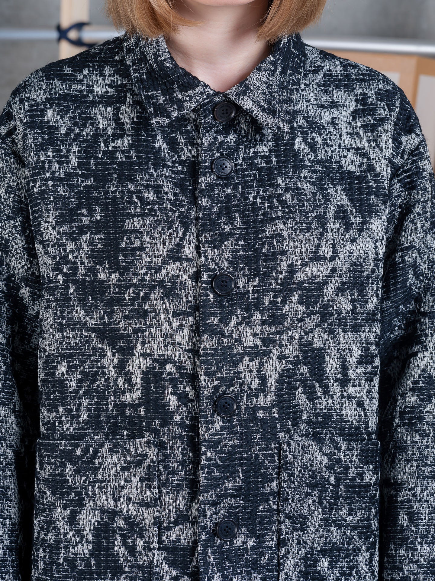Close-up of Henrik Vibskov Wheel Jacket in Black 3D White on model.