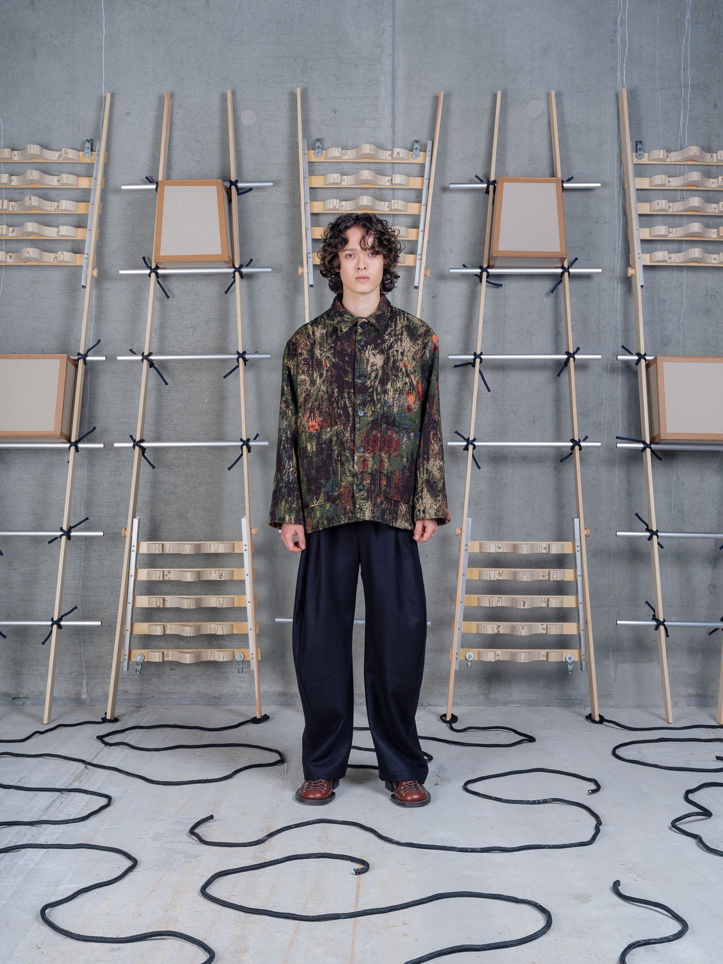 Henrik Vibskov Wheel Jacket in Gobelin Swamp worn from the front, showcasing the relaxed fit and Gobelin-inspired pattern.