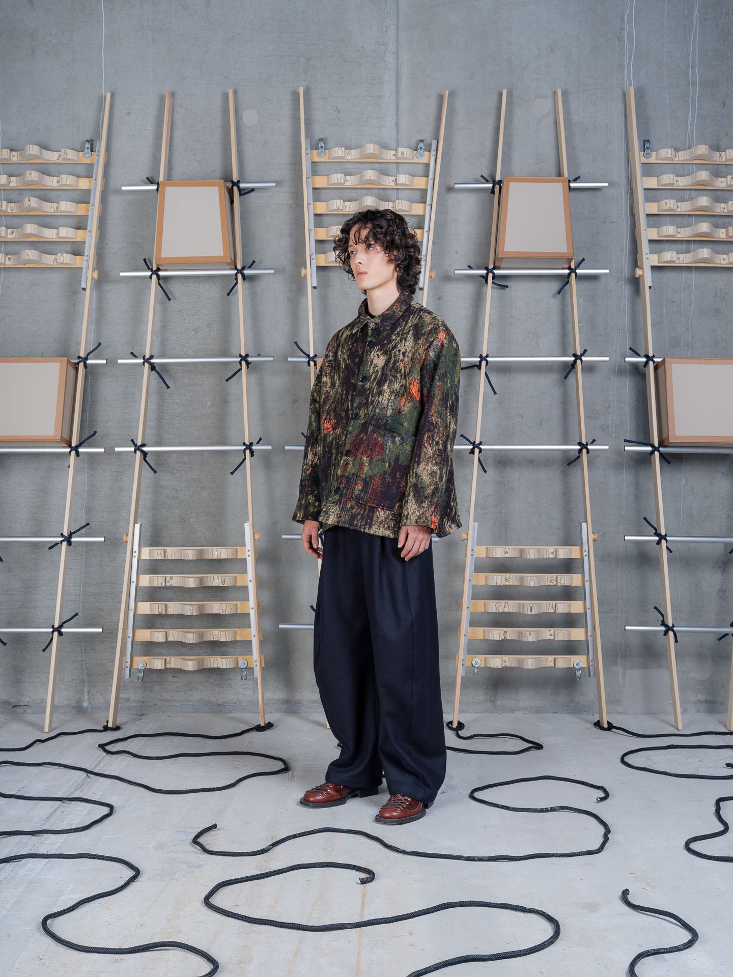 Side view of Henrik Vibskov Wheel Jacket in Gobelin Swamp highlighting the textured woven fabric.