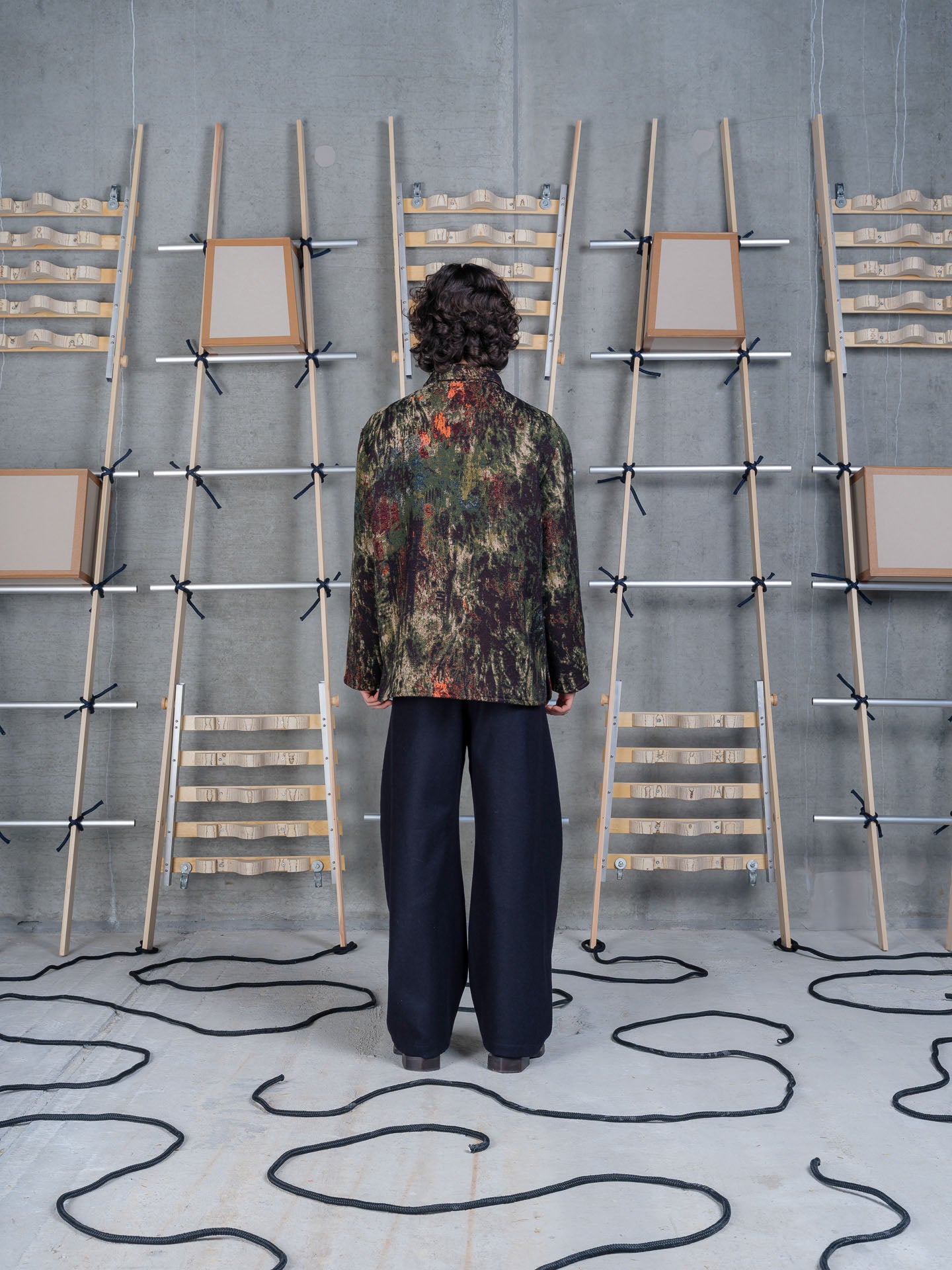 Back view of Henrik Vibskov Wheel Jacket in Gobelin Swamp showcasing the Gobelin Swamp pattern and relaxed silhouette.