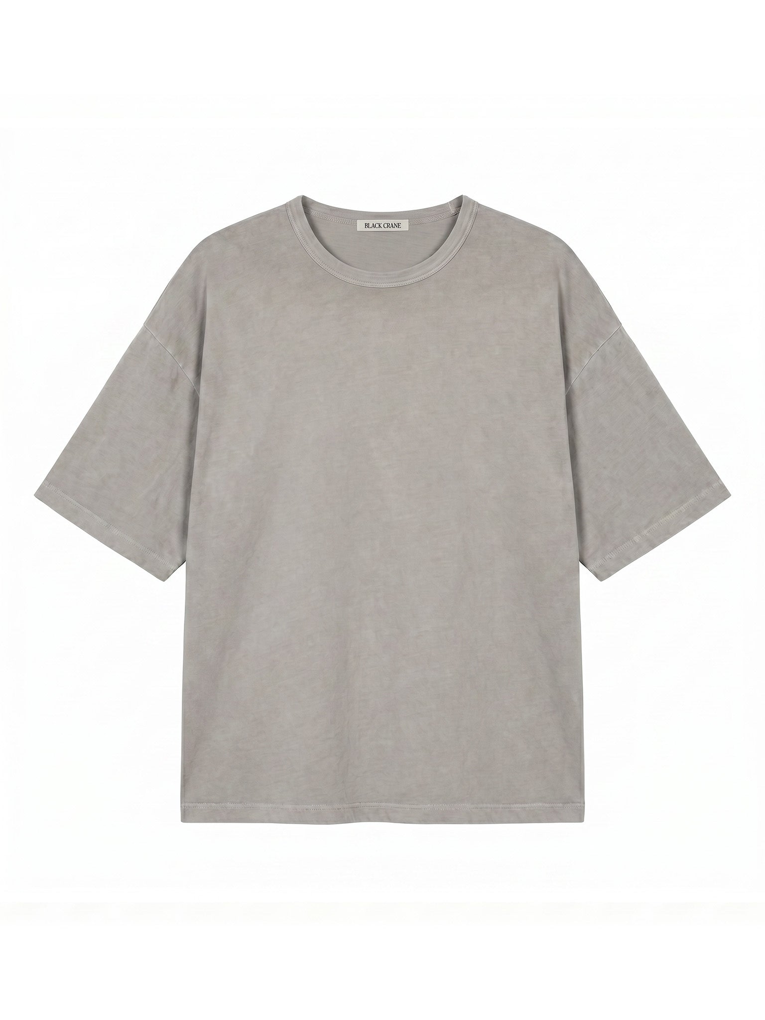Black Crane Wide Short Sleeve Tee in Grey - flat lay showing boxy silhouette and crew neck in Japanese textured jersey