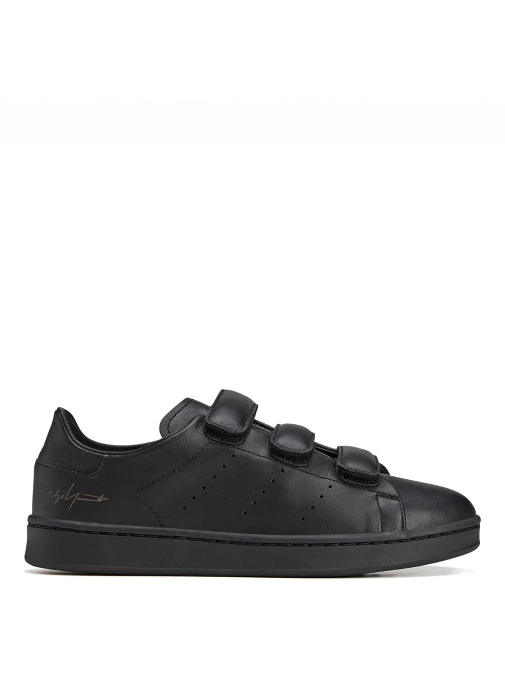 Side packshot of the Y-3 Stan Smith Hook-and-Loop Shoes in Black, showing the black leather upper, hook-and-loop strap closure, and perforated 3-Stripes.