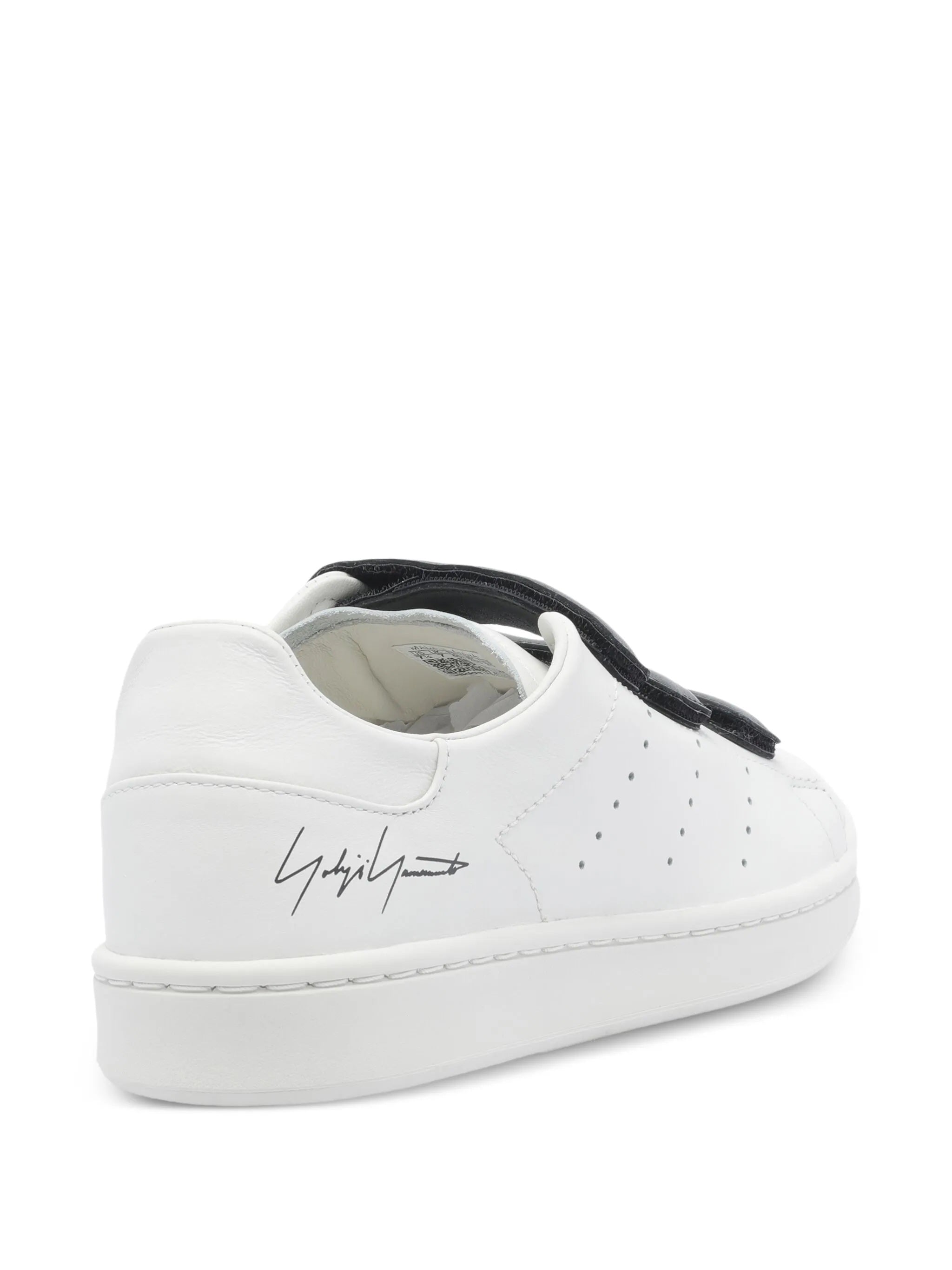 White sneaker with black accents on a white background