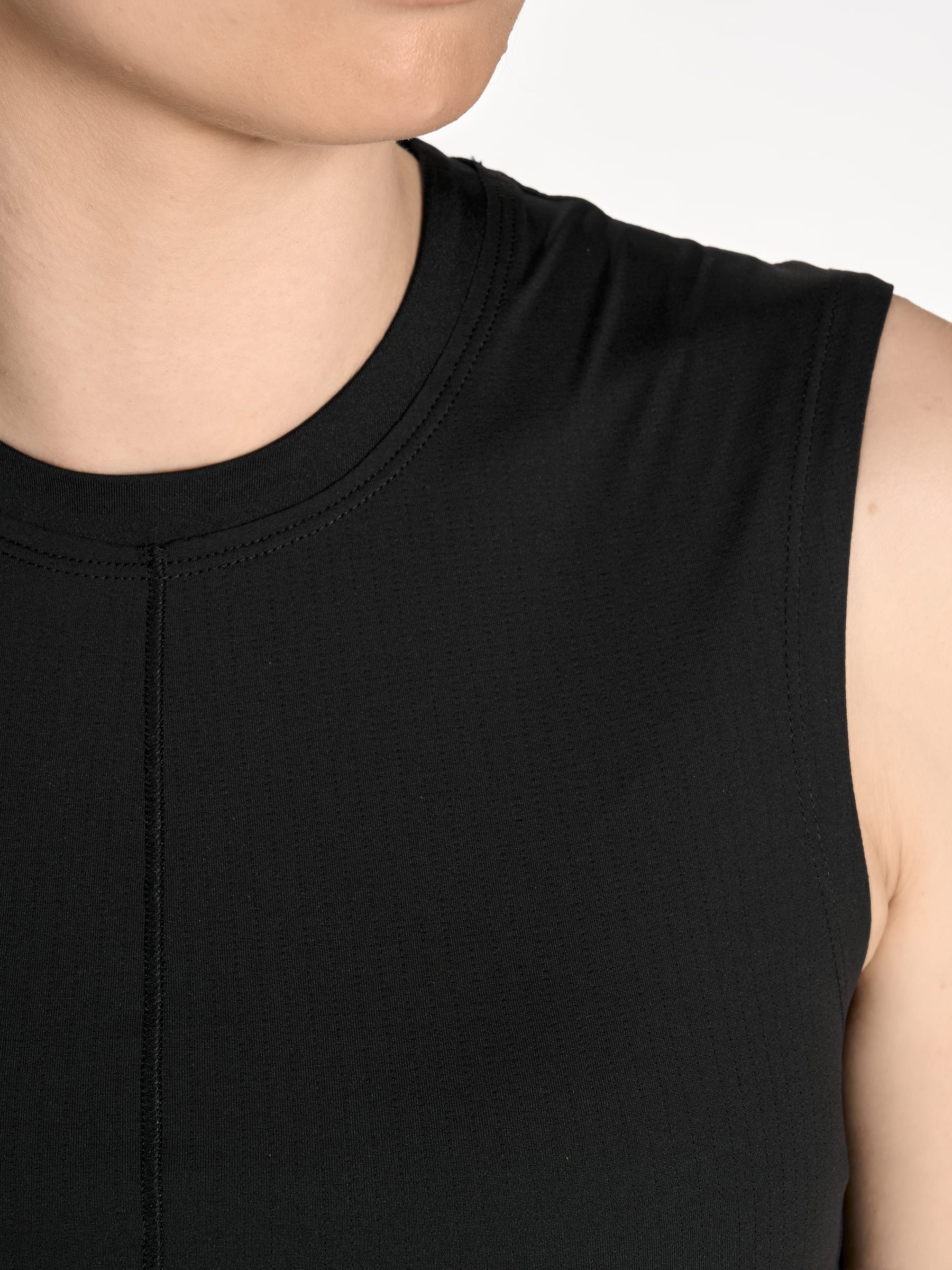 Close-up of the back of the Y-3 Women’s Knit Double-Dye Tank in Beige on a model, highlighting the dip-dye pattern and satin logo detail.