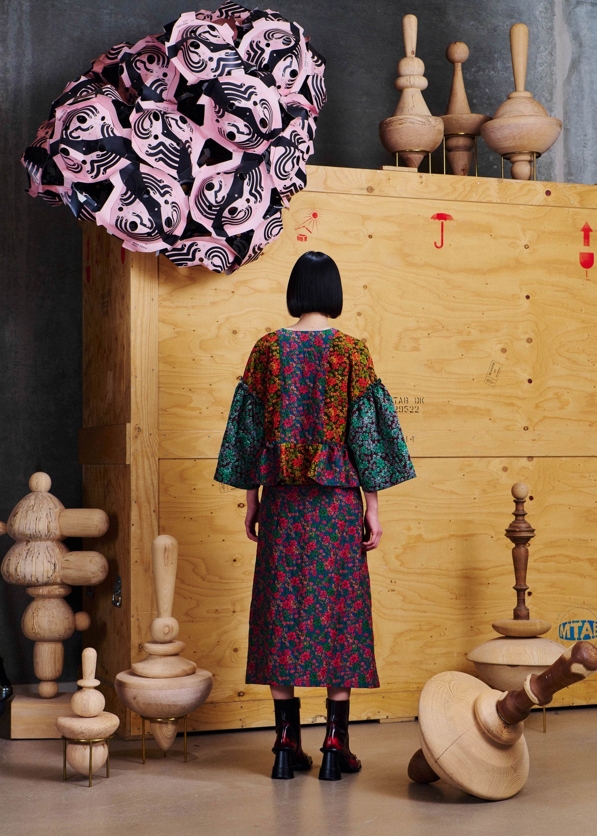 Henrik Vibskov Leek Skirt in Floral Affairs worn back view, showing the all-over floral patchwork print and straight midi-length silhouette.